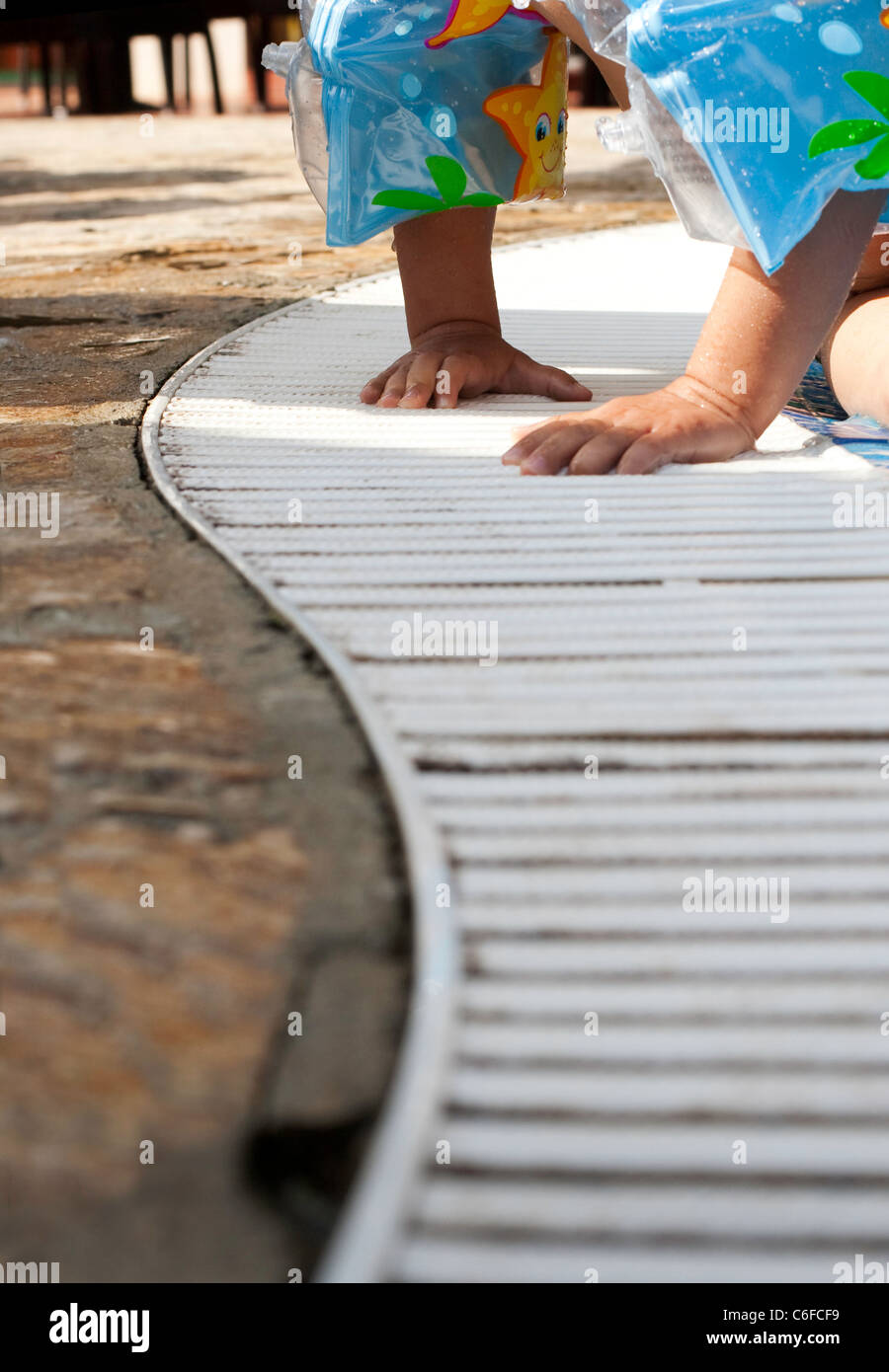 children's hands in swimming pool Stock Photo Alamy