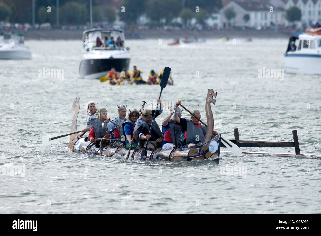 Team rowing boat in bay hi-res stock photography and images - Alamy