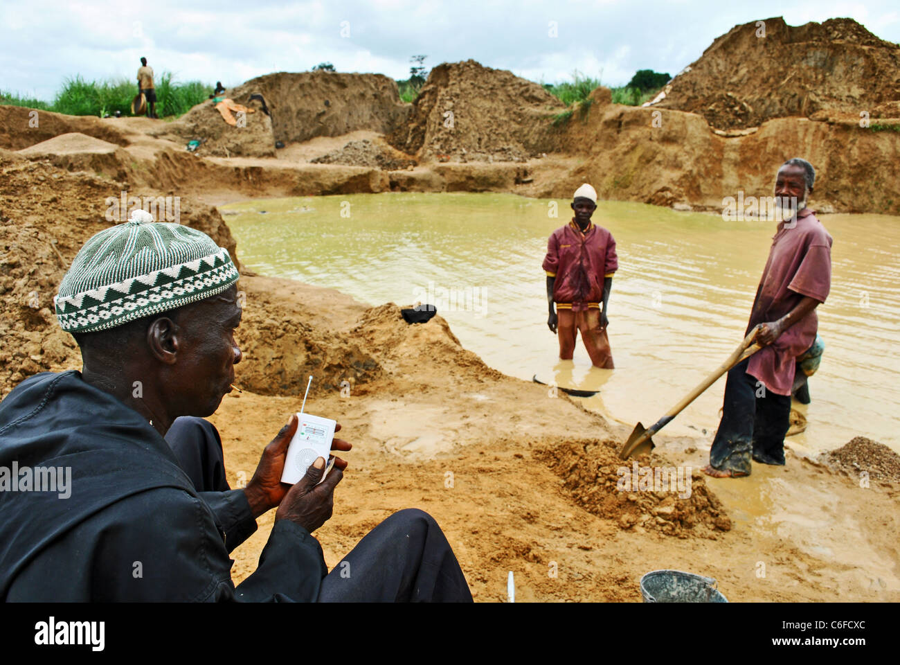 Man with radio at diamond mines in Kono, Sierra Leone Stock Photo - Alamy