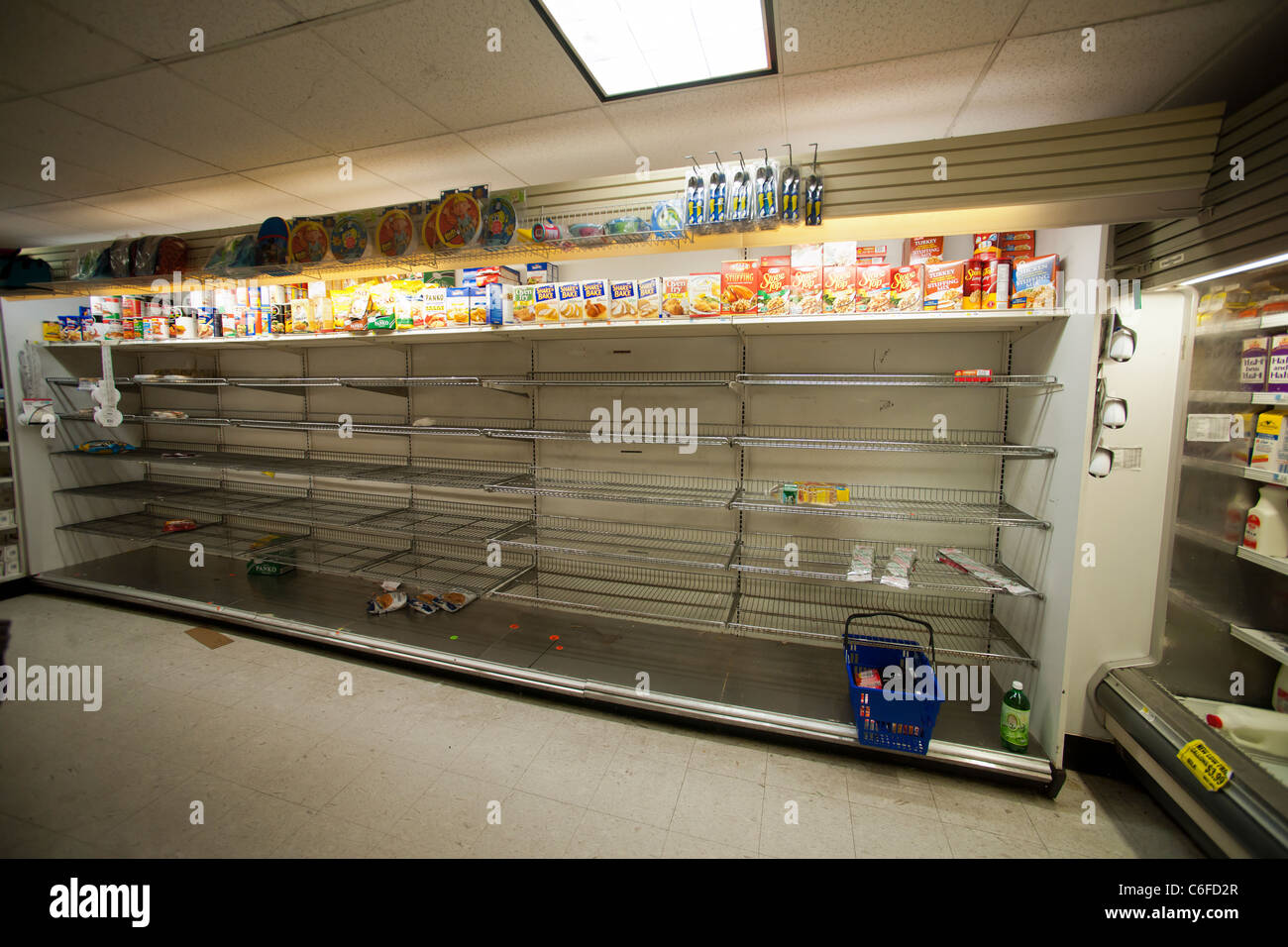 Shelves stripped bare of bread by customers stocking up for Hurricane