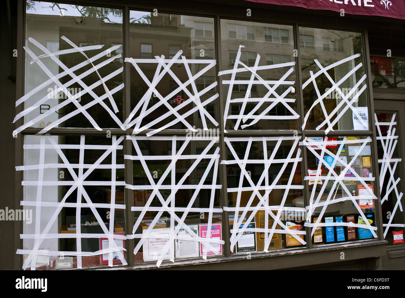 Stores in the Chelsea neighborhood of NY tape windows as protection