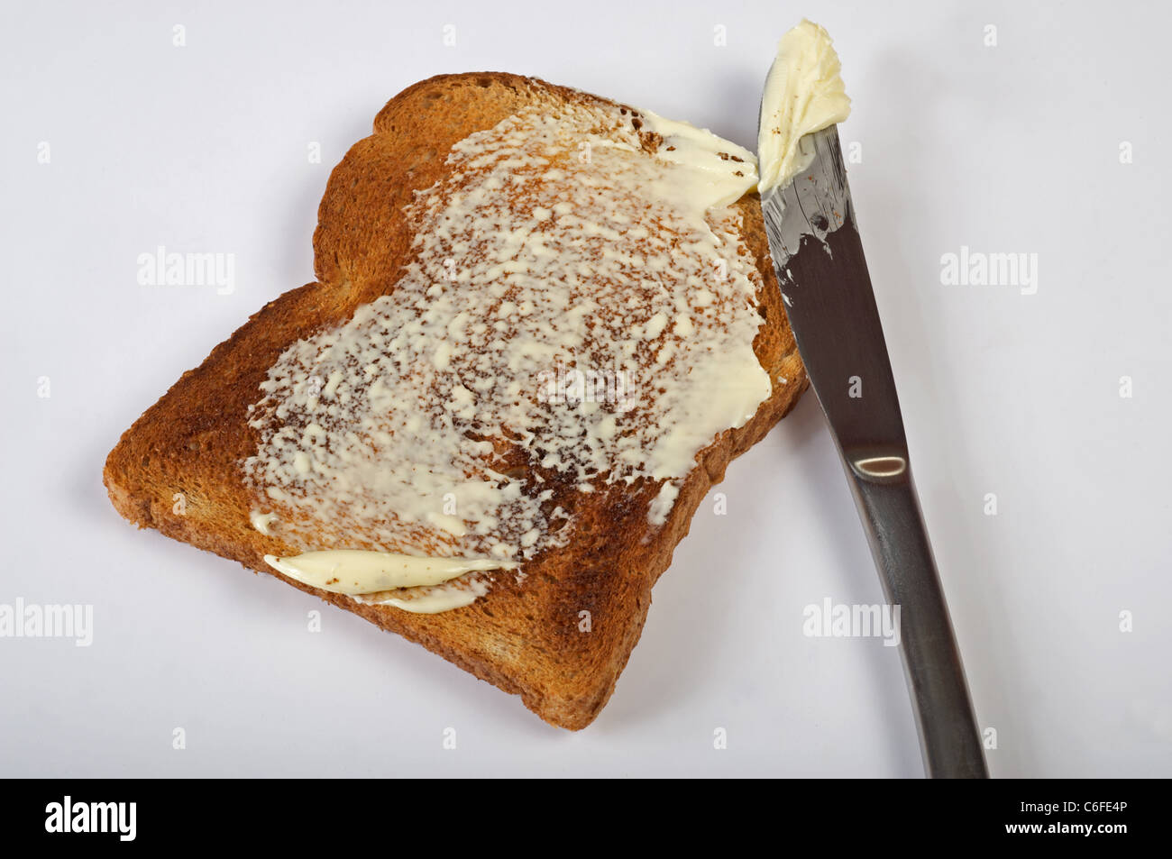 Brown wholemeal bread buttered toast Stock Photo Alamy
