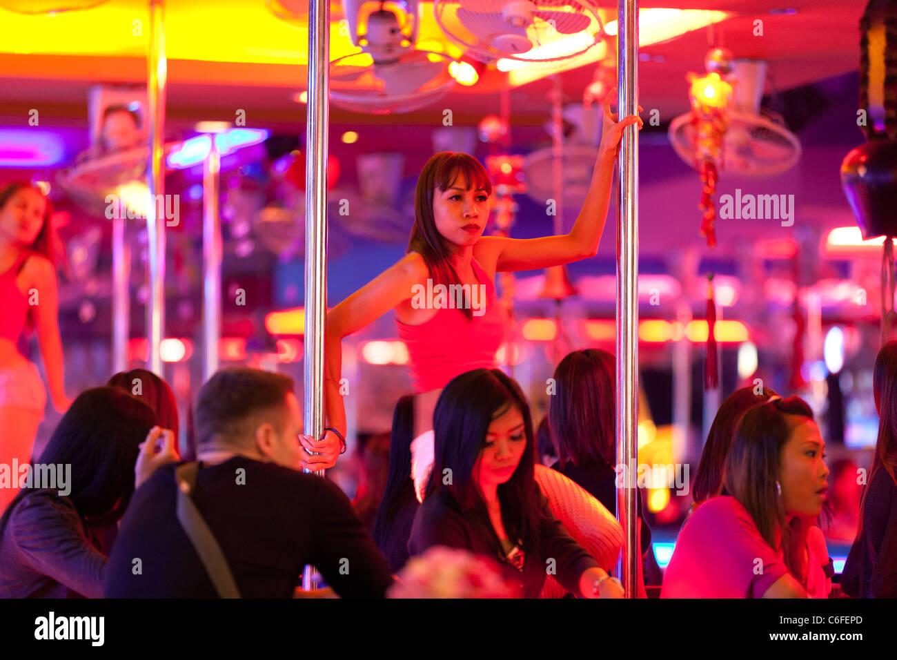 young sexy thai girls performing pole dancing in pattaya gogo bar in walking street, pattaya, thailand Stock Photo