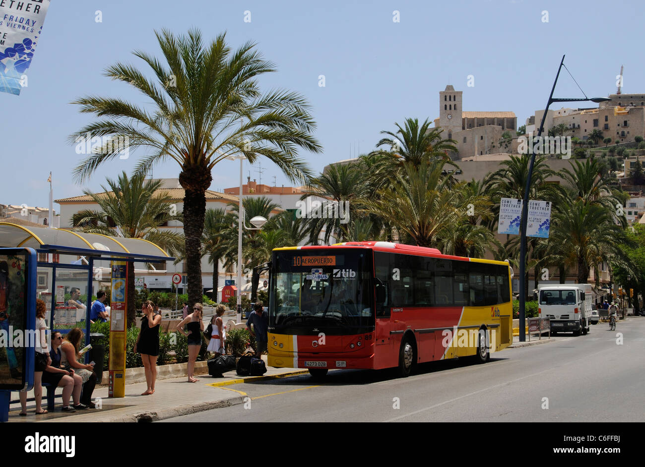 Passengers boarding the airport bus service in Eivissa town centre on Ibiza a Spanish holiday Island Stock Photo