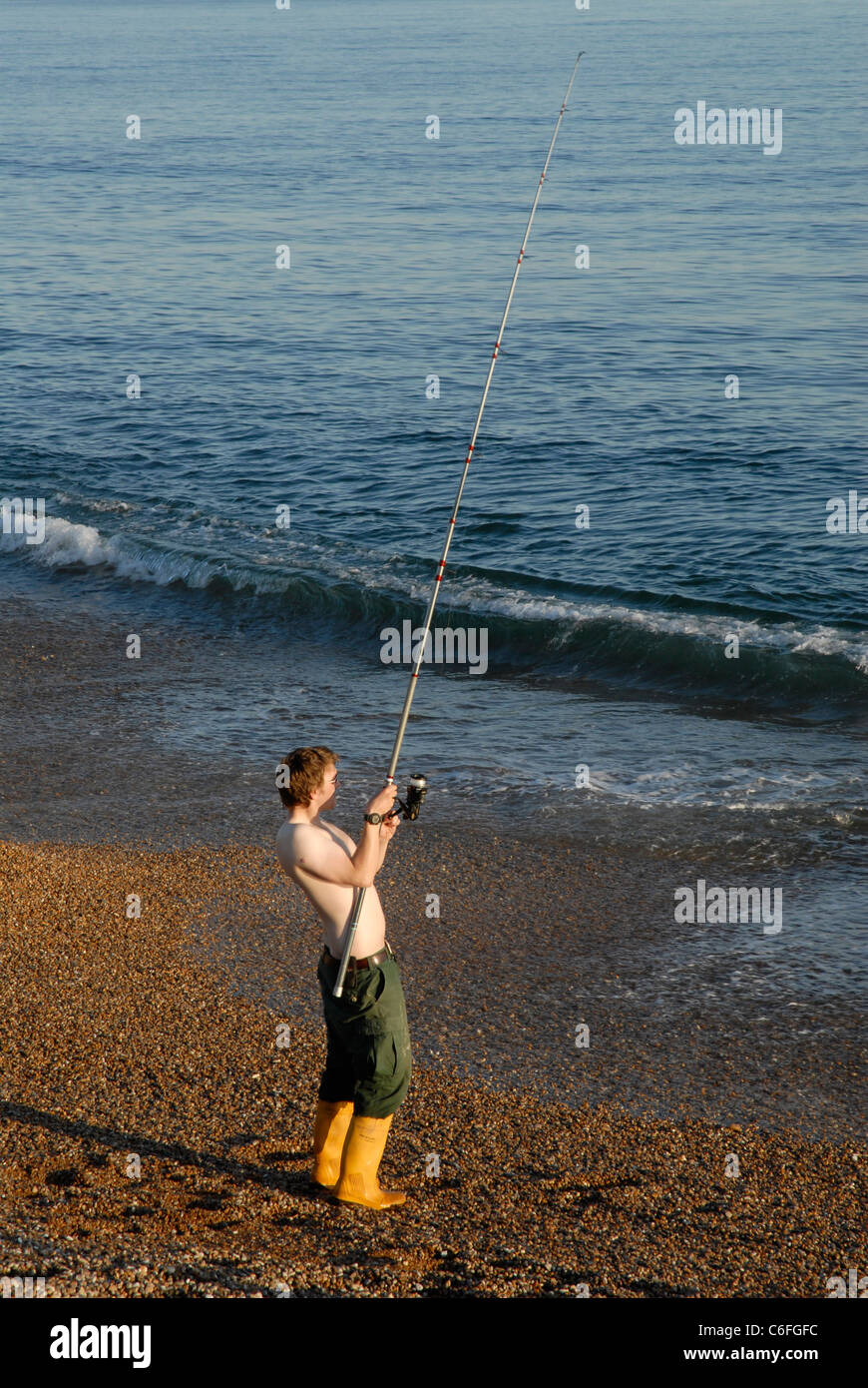 Fishing from Chesil Beach in Dorset Stock Photo Alamy