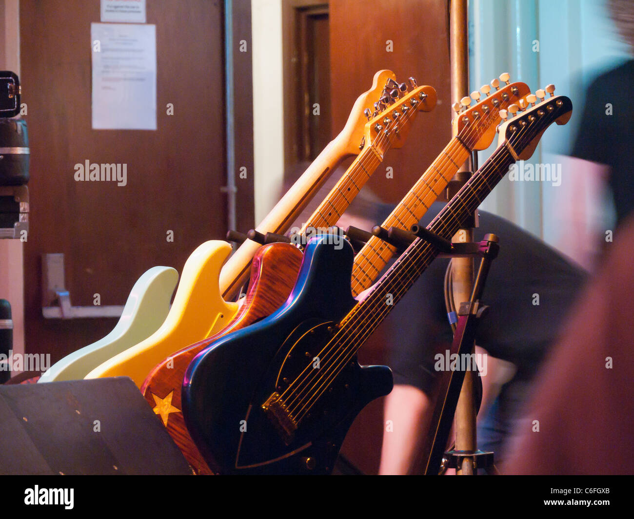 Musicians prepare equipment and guitars for gig Stock Photo Alamy