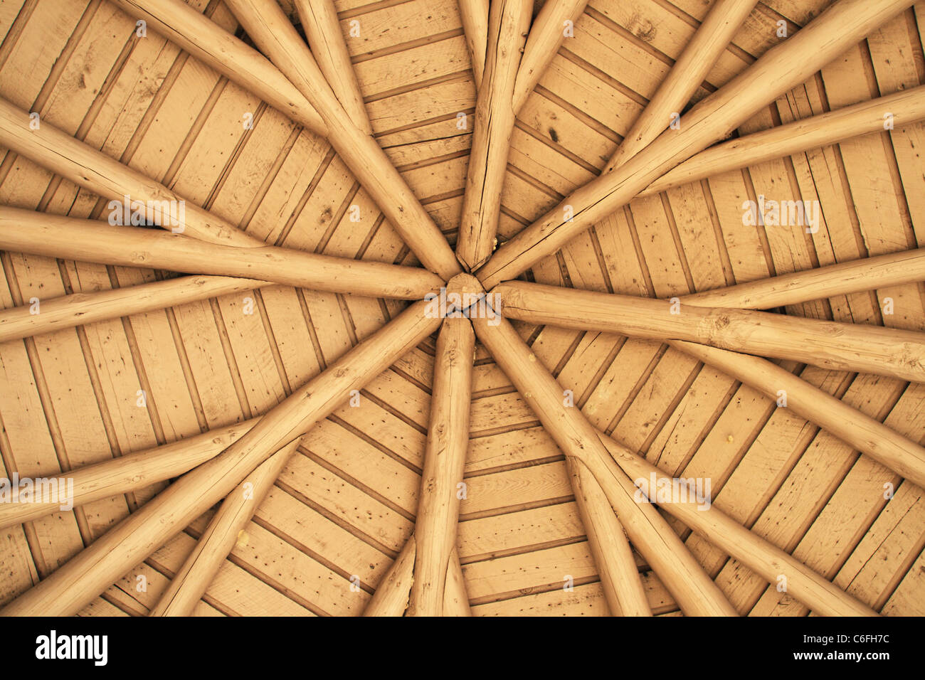 view up at ceiling of outdoor gazebo showing radial roof beams Stock Photo