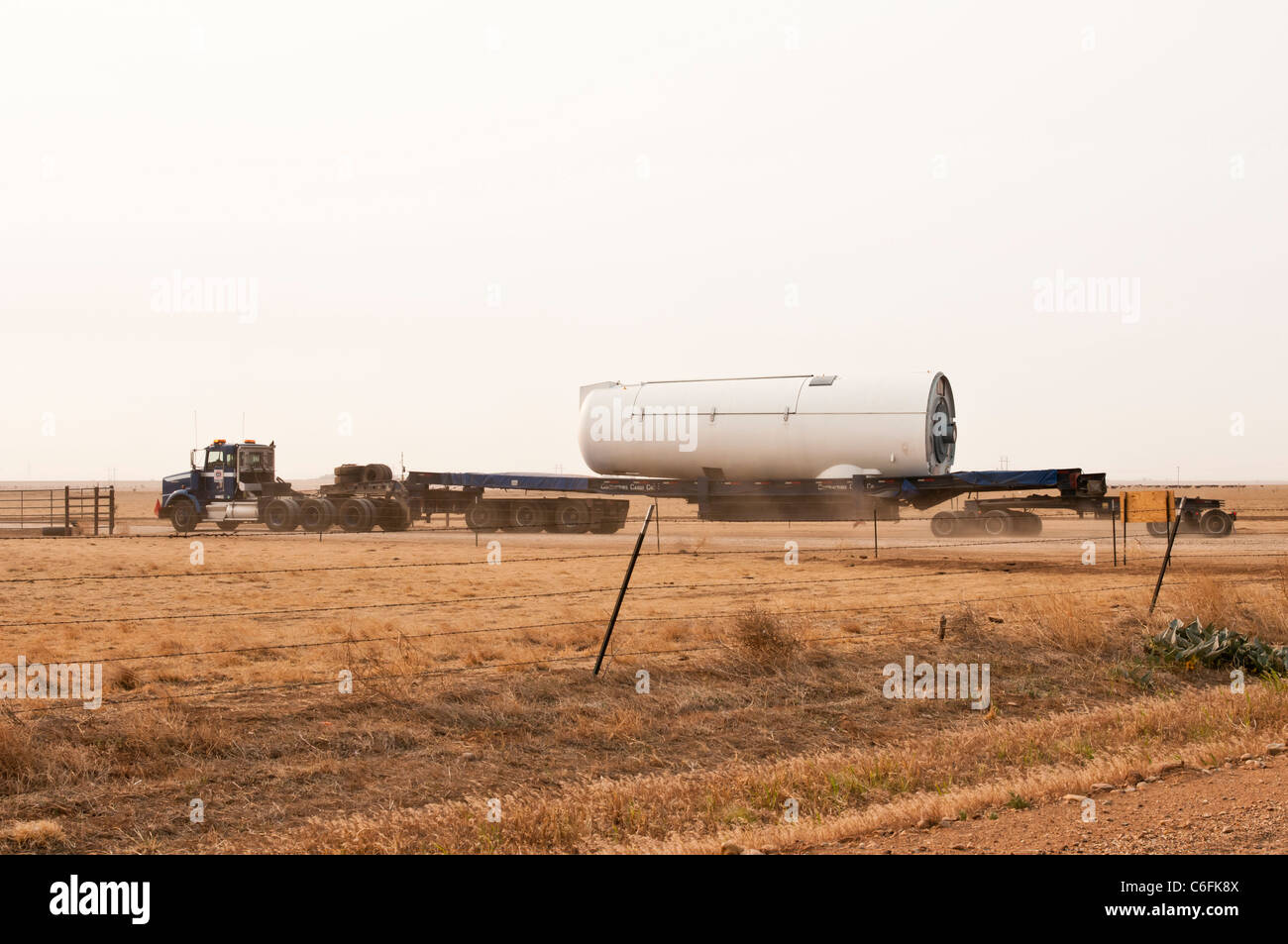 The generator hub for a horizontal-axis wind turbine is delivered to a construction site near Amarillo, Texas. Stock Photo