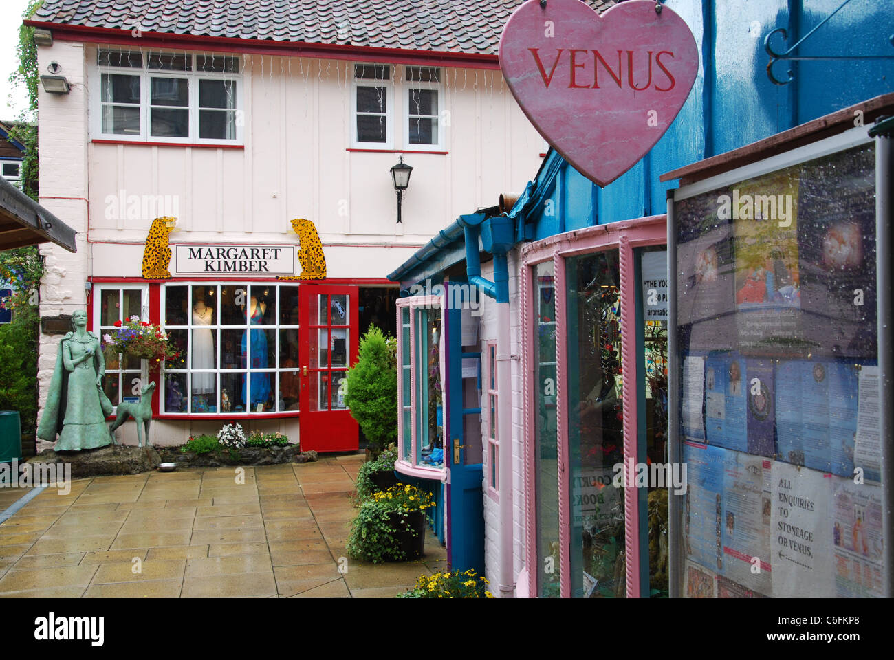 Colourful shops at the Glastonbury Experience in Glastonbury High Street Somerset England Stock