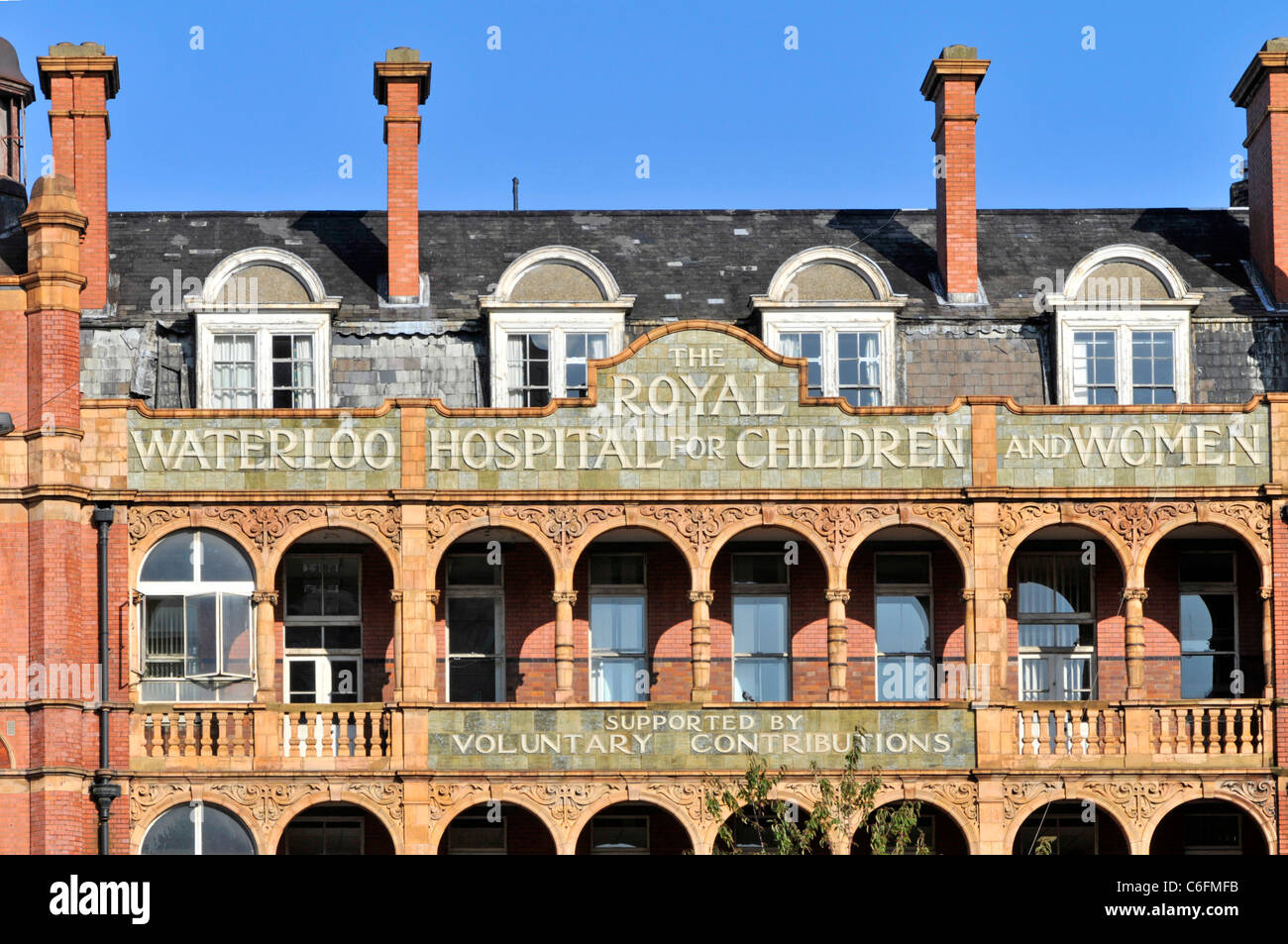 Front elevation The Royal Waterloo Hospital for Children & Women listed building with tiered terracotta arch balcony façade London England UK Stock Photo