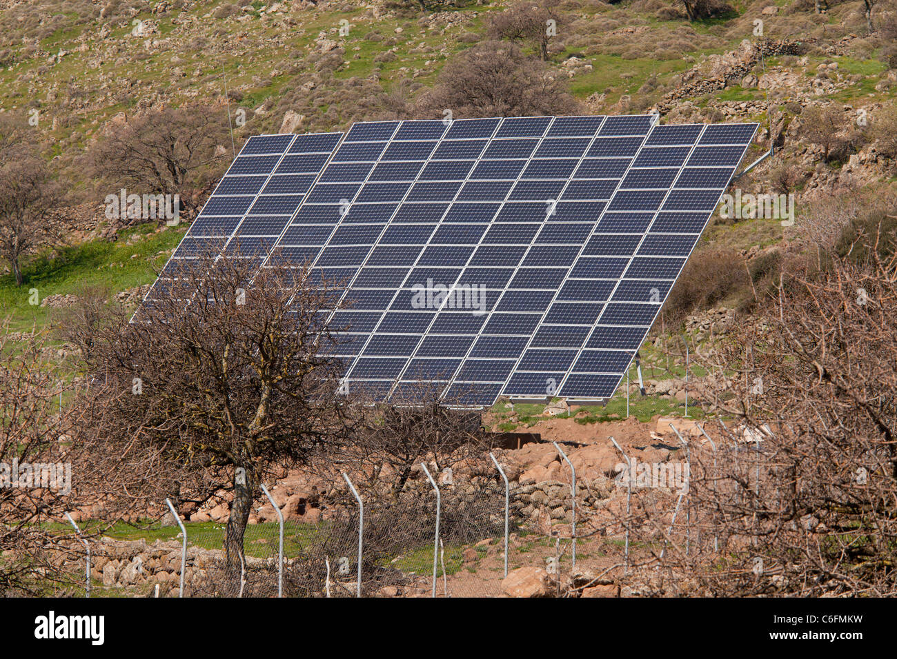 Extensive solar panel arrays in the countryside of west Lesvos (Lesbos), Greece. Stock Photo