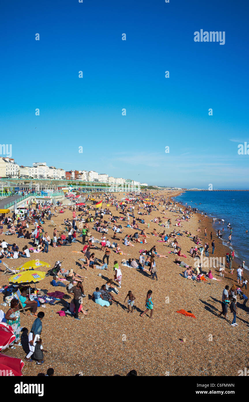 Crowded beach Brighton UK Stock Photo