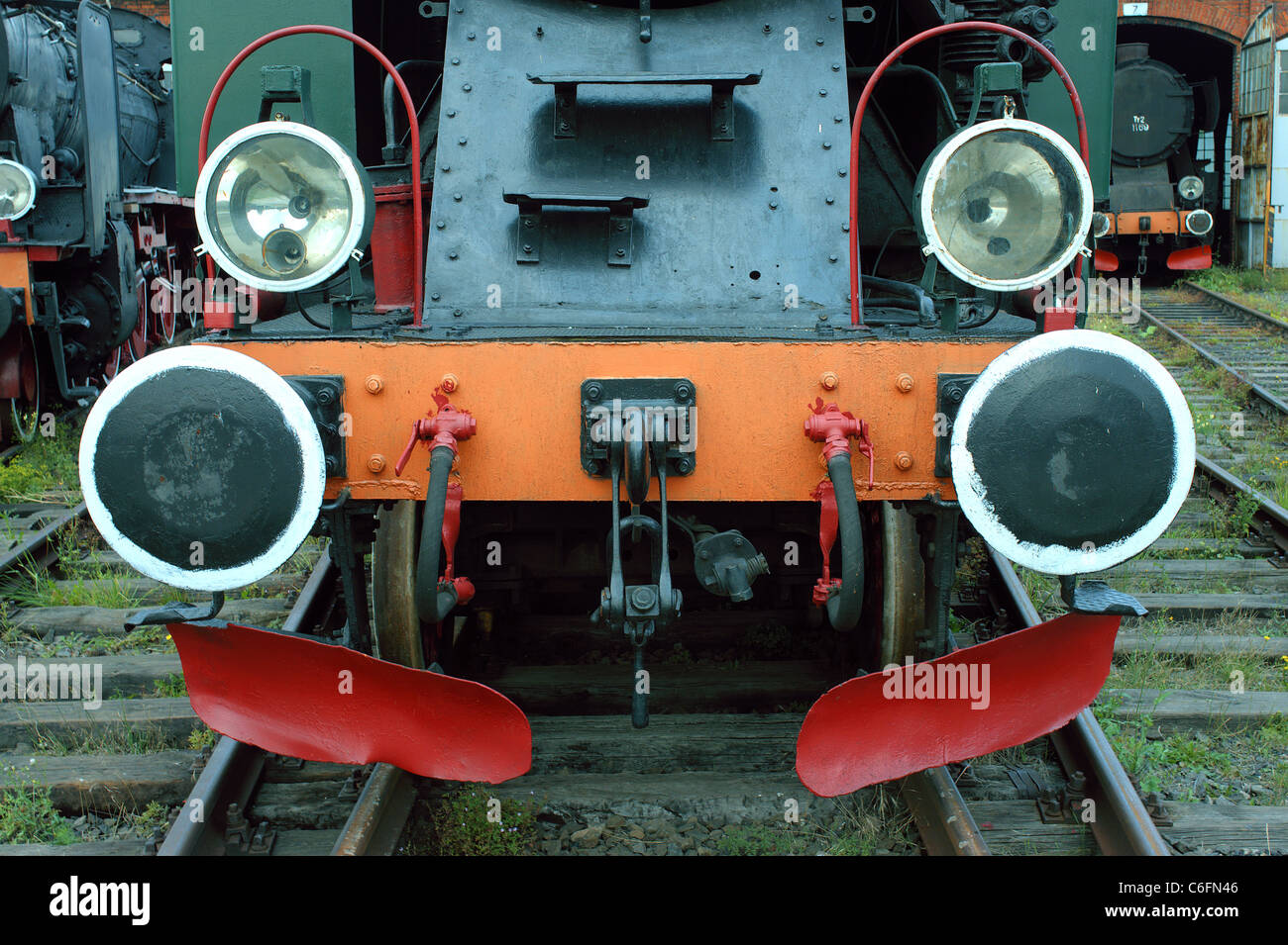 Vintage steam engine locomotive nice friendly sympathetic reliable trusty likable lovable gazing staring bumpers headlights Stock Photo