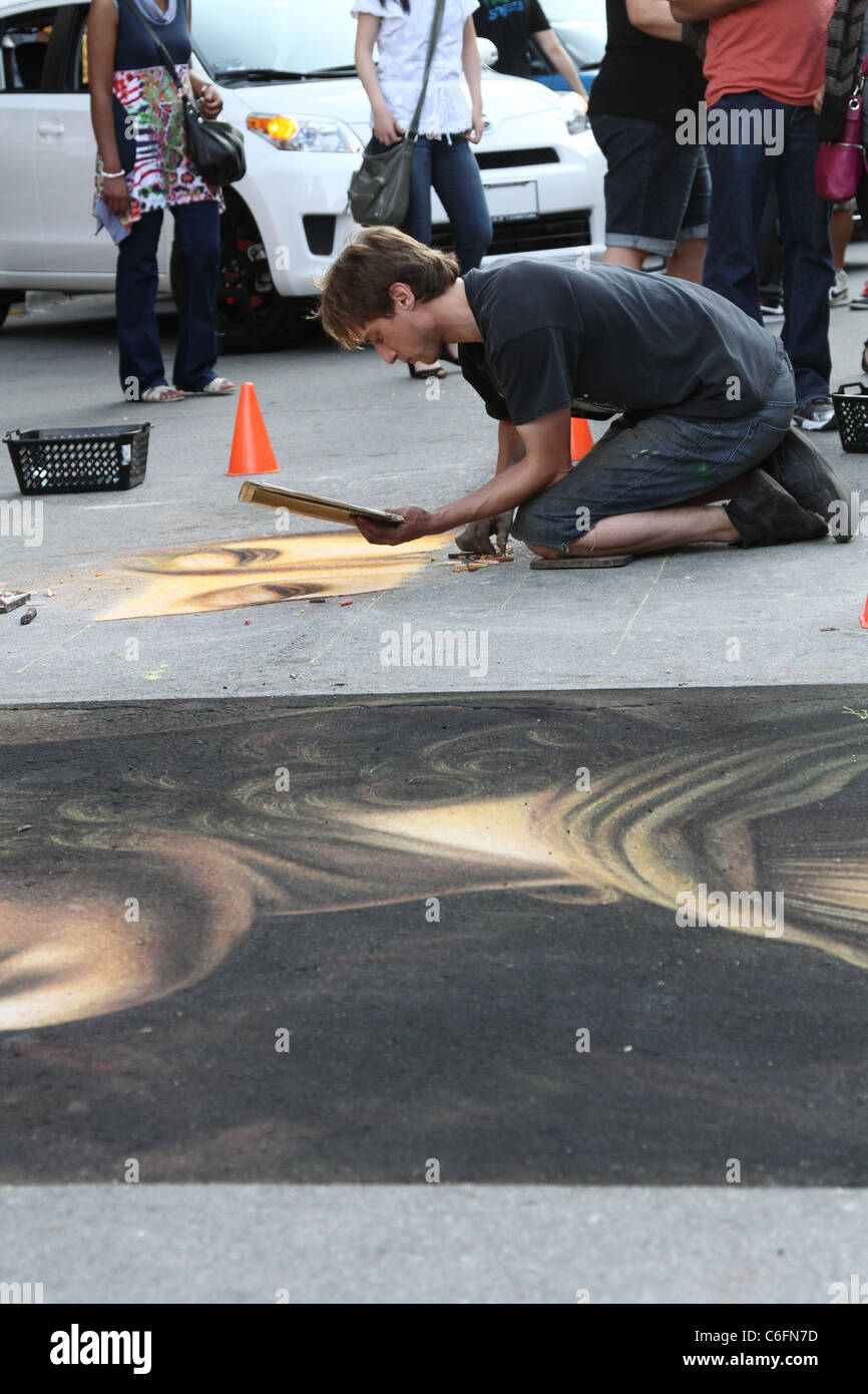 chalk artist drawing sidewalk Stock Photo