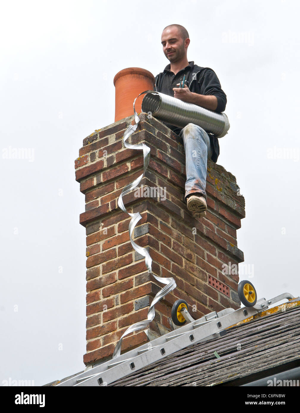 Lining a chimney for wood burning Stock Photo