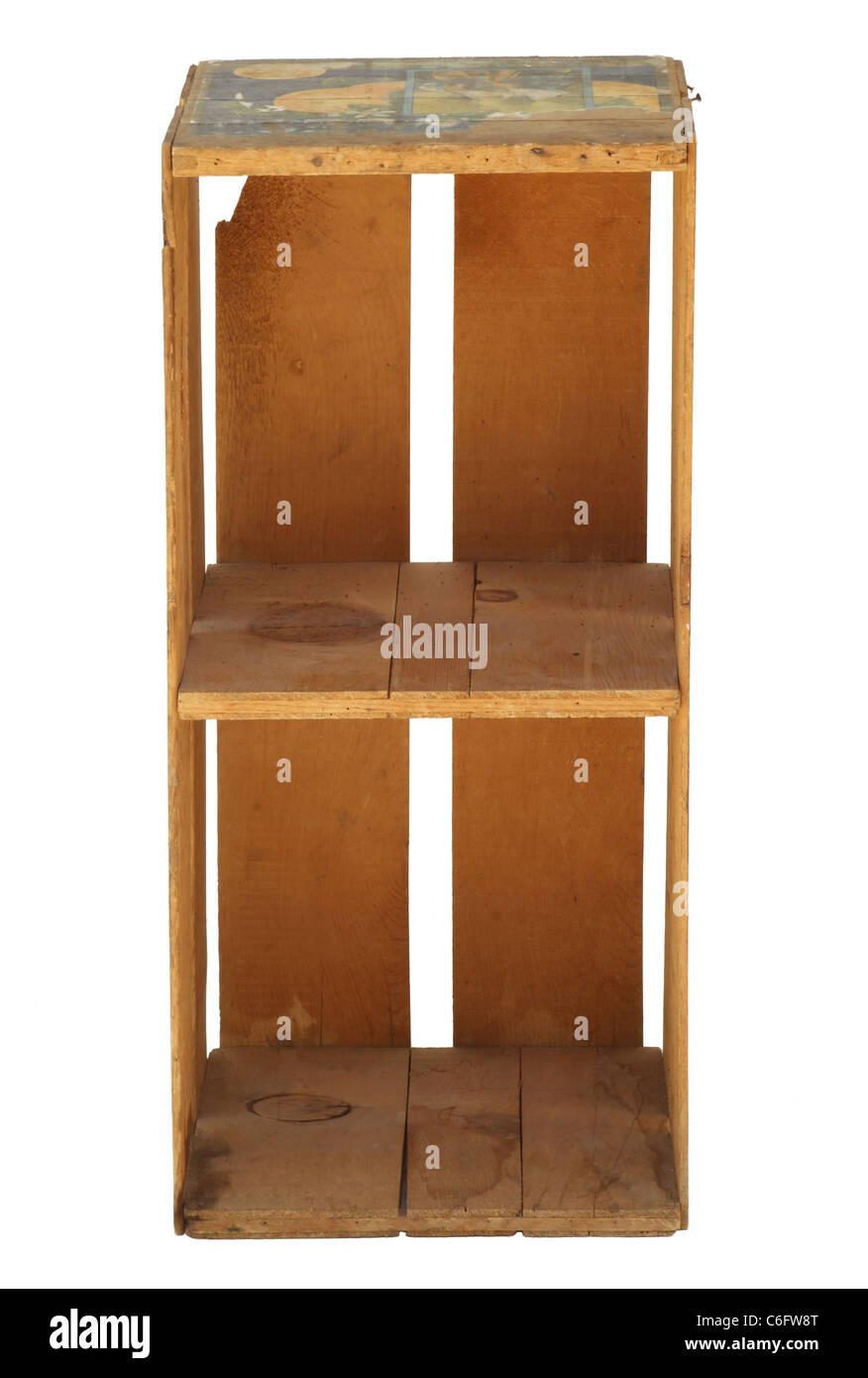 Isolated old wood upright orange fruit crate with a divider making 2 shelves. Stock Photo