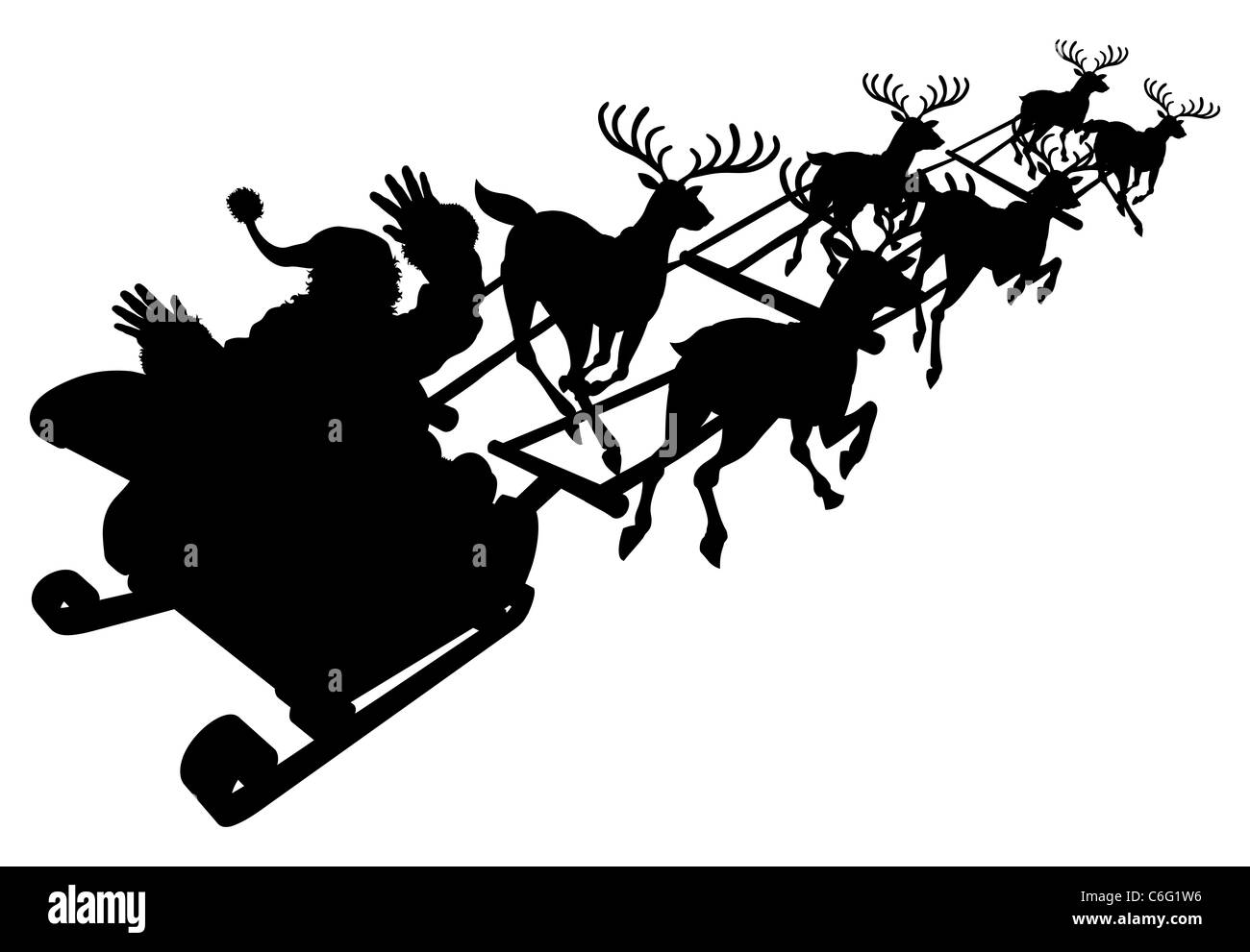 Santa in his Christmas sled or sleigh in silhouette Stock Photo