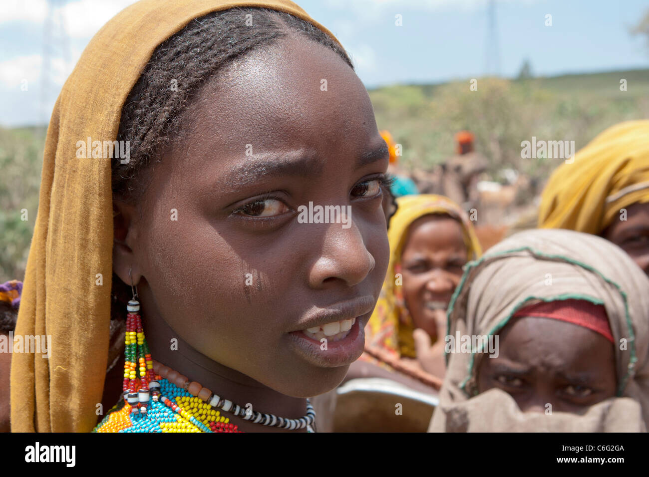 Oromo tribeswomen at a watering-hole in the Chercher  Mountains, Eastern Ethiopia, Africa. Stock Photo