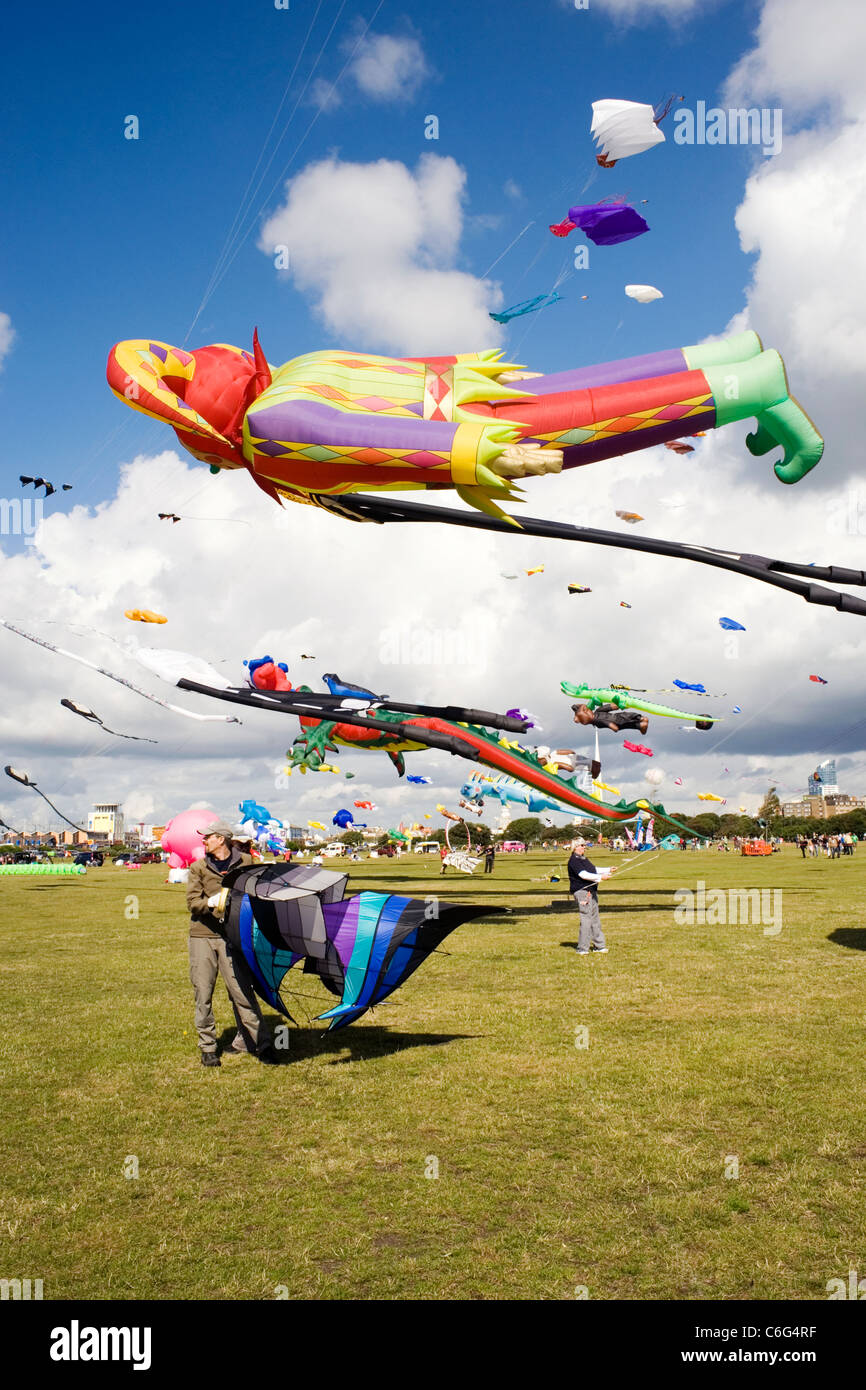 colourful kites of all shapes and sizes flying at southsea kite festival Stock Photo