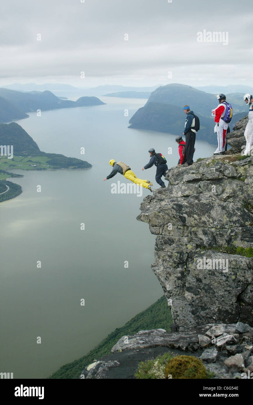 Base Jumpers Base Hopping from the summit of Gridsetskolten mountain in Romsdal, Norway. Photo:Jeff Gilbert Stock Photo