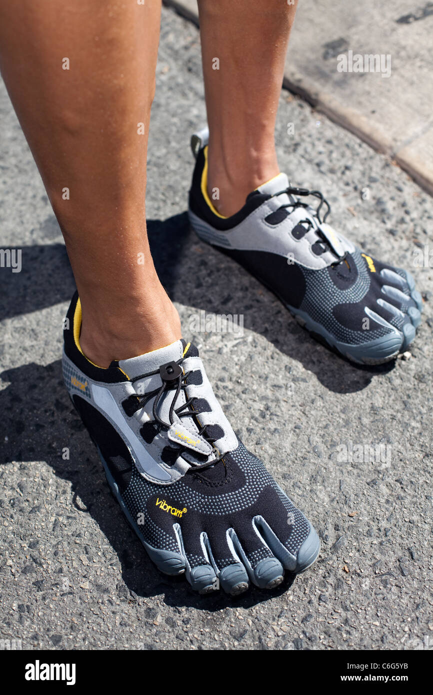 Man with vibram fivefingers shoes Stock Photo - Alamy