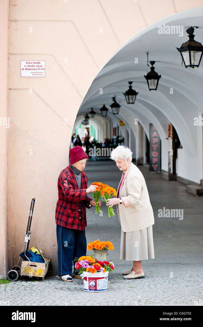 Lady selling flowers, Old Town in Jelenia Gora, Lower Silesia, Poland Stock Photo
