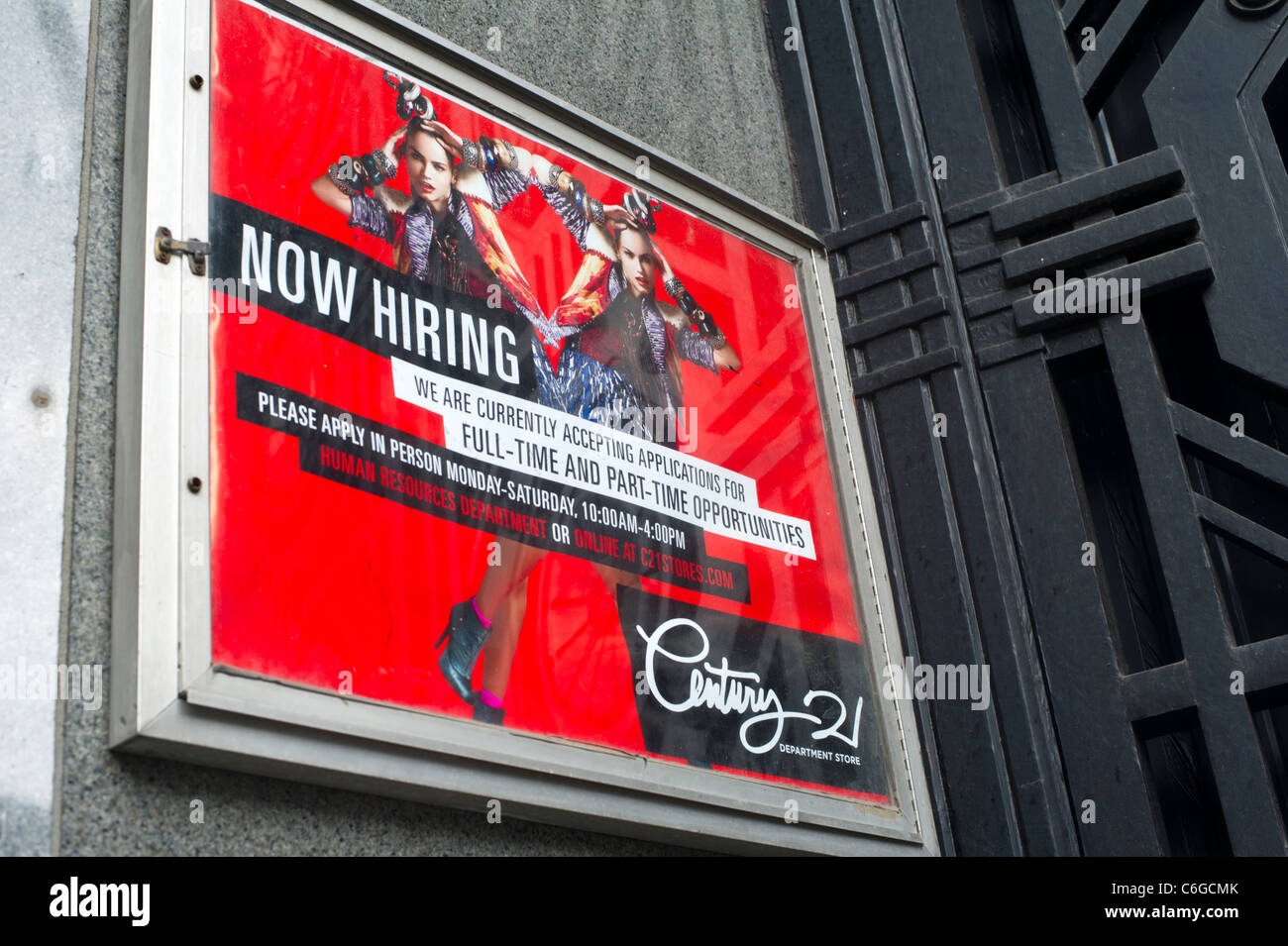 A Now Hiring sign at Century 21 seen in Lower Manhattan on Saturday, August 27, 2011. (© Frances M. Roberts) Stock Photo