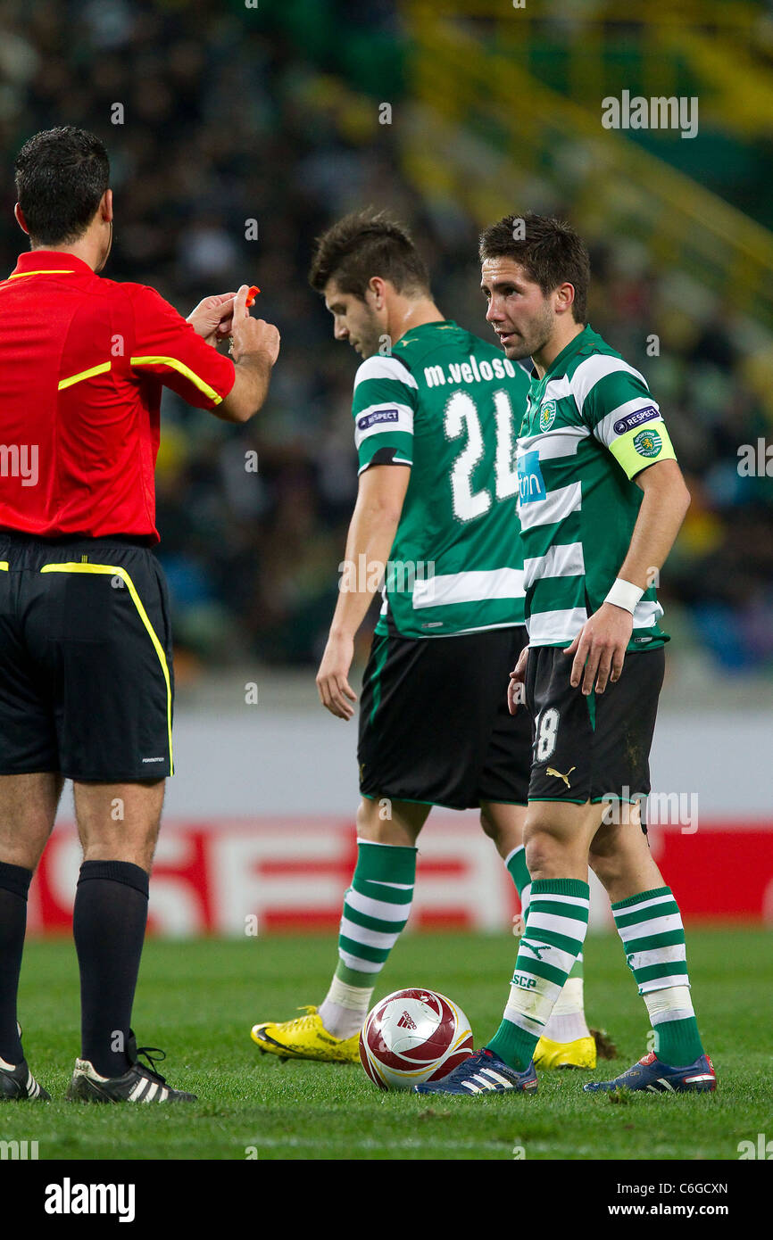 Alon Yefet, referee, talks to Joao Moutinho from Sporting and Miguel