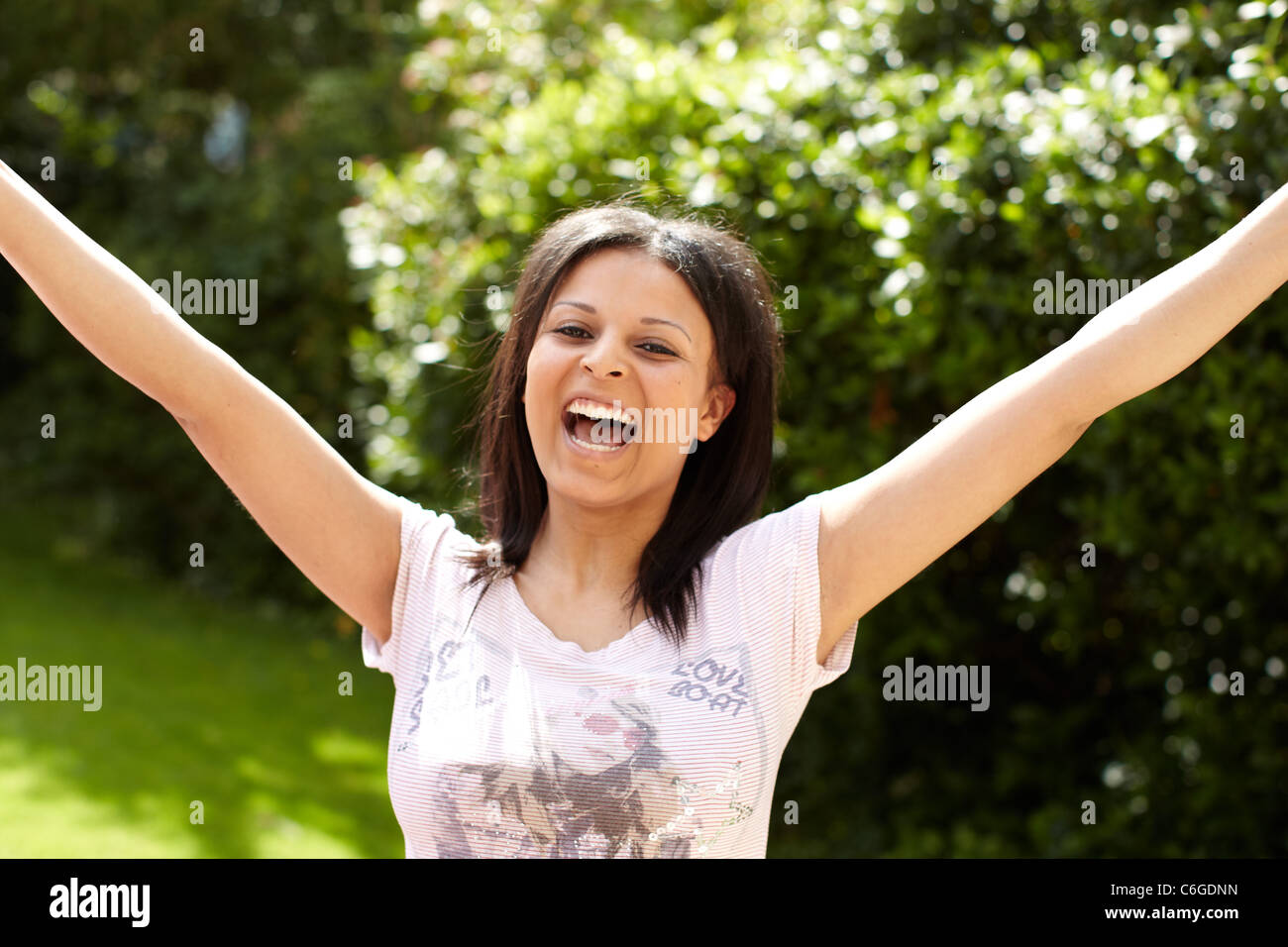 Ethnic girl sat with exam results Stock Photo