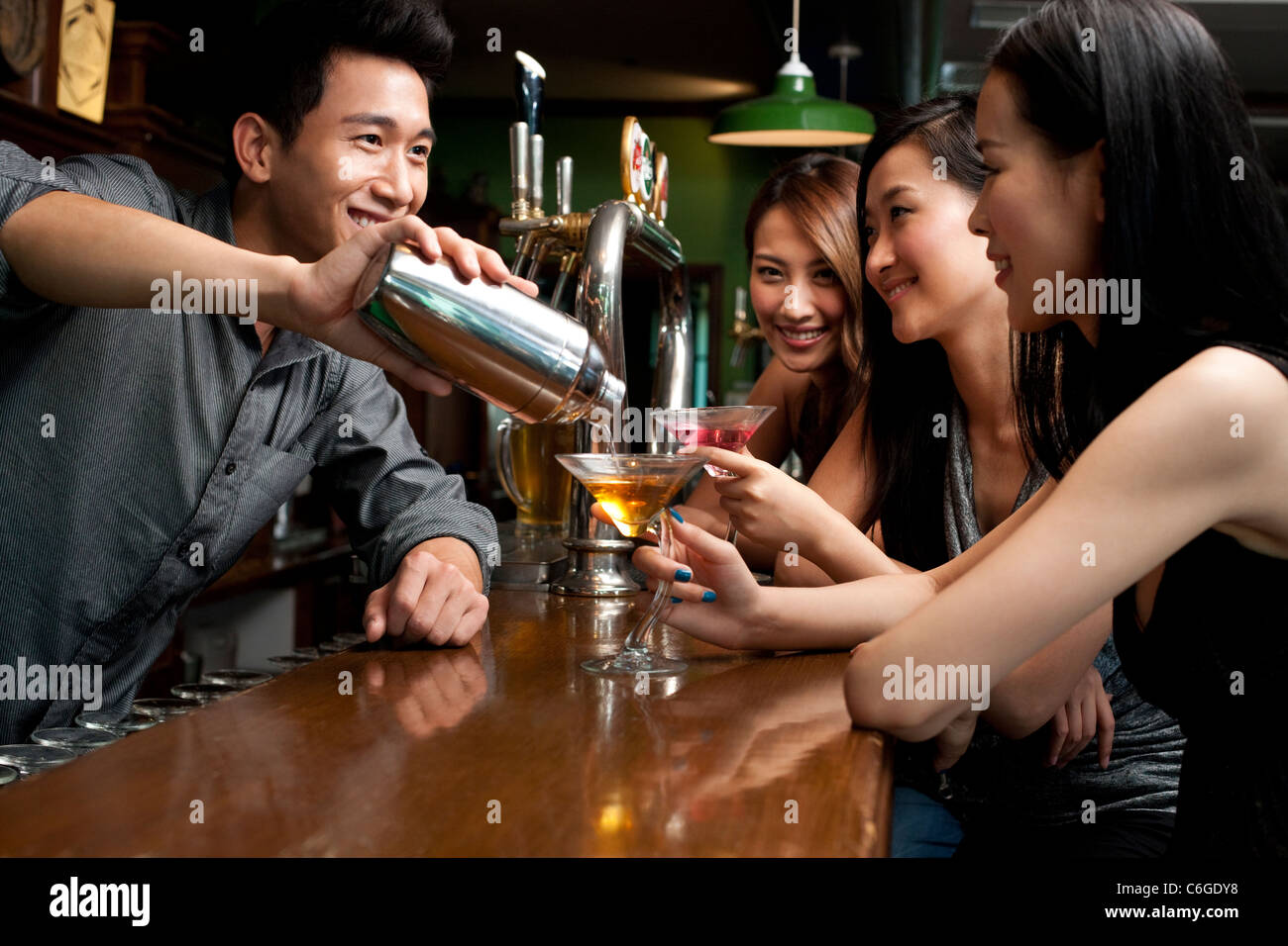 Bartender Serving Drinks Stock Photo Alamy
