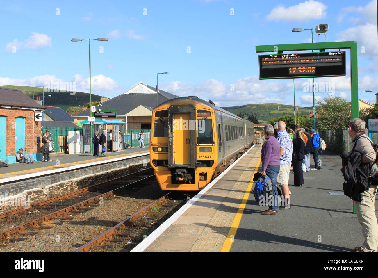 Class 158 dmu passenger train on the Cambrian coast line for Pwllheli arriving at Tywyn in Gwynedd, Wales on 9th August 2011.. Stock Photo