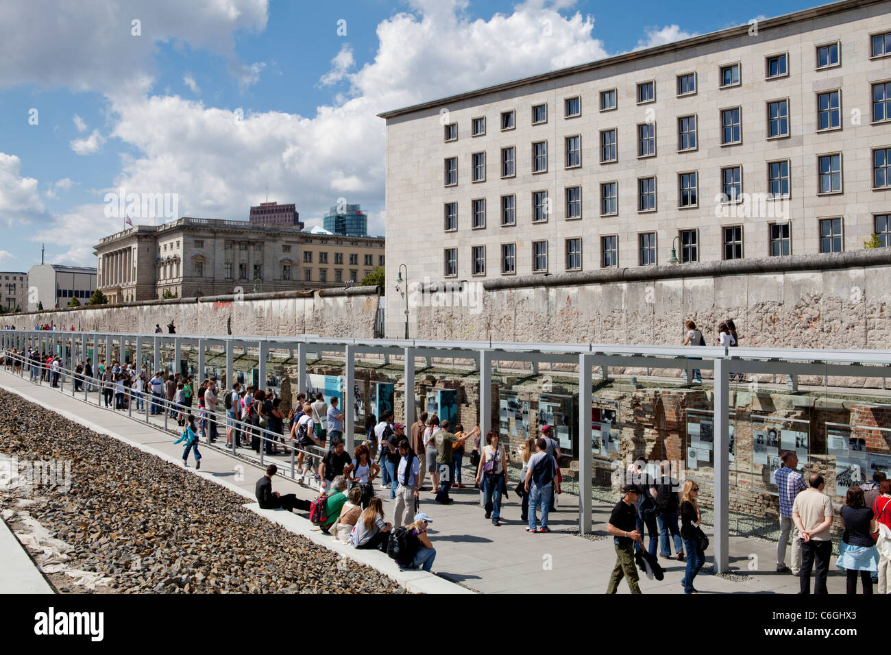 Berlin Wall. Tourists visiting the remains of the Wall that divided the town of Berlin. Germany Stock Photo