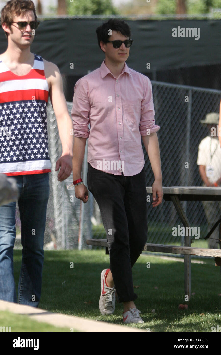 Ezra Koenig Vampire Weekend lead singer walking with a friend at the