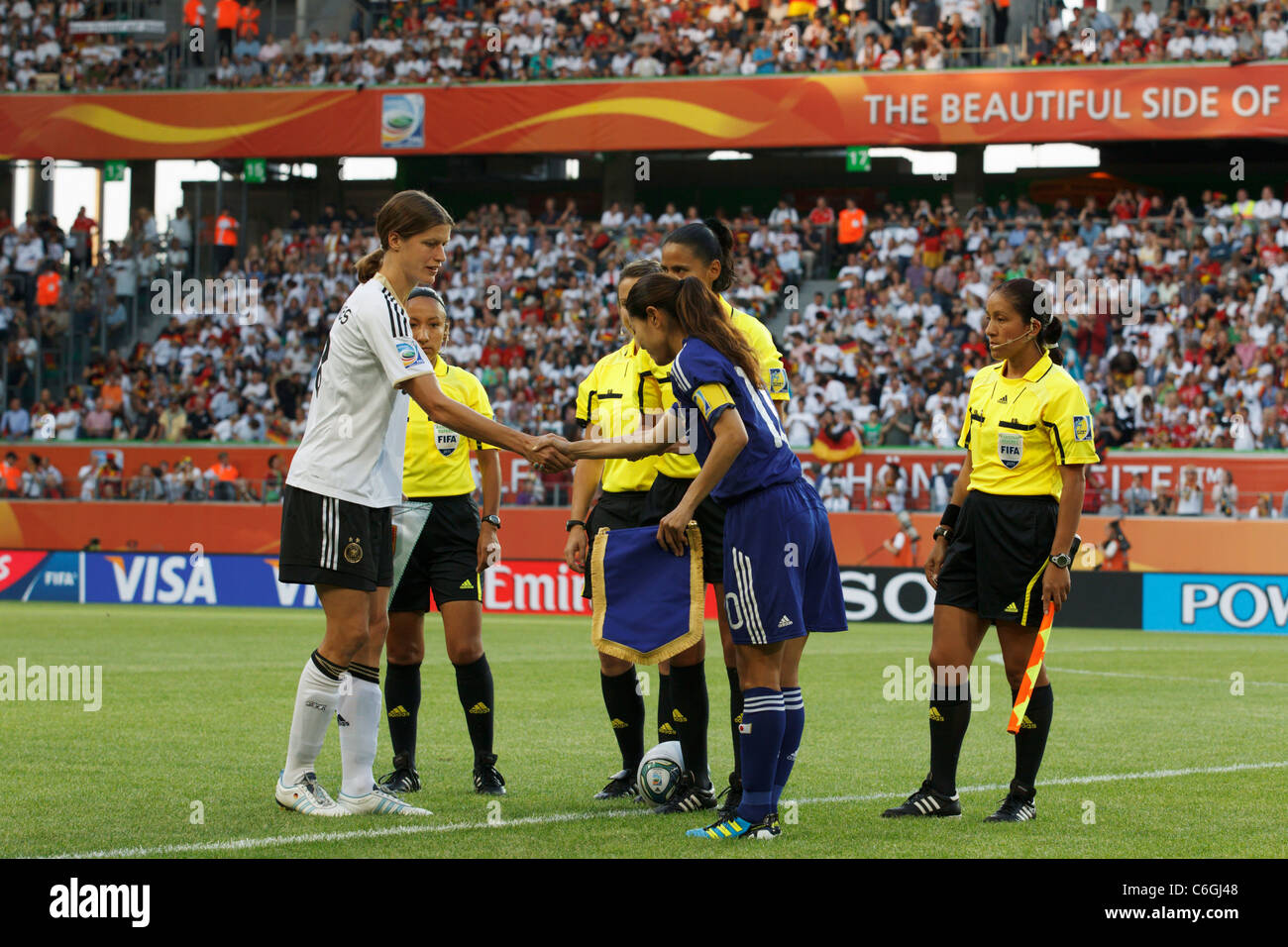 Captains Kerstin Garefrekes of Germany (l) and Homare Sawa of Japan (r) shake hands before a 2011 World Cup quarterfinal match. Stock Photo