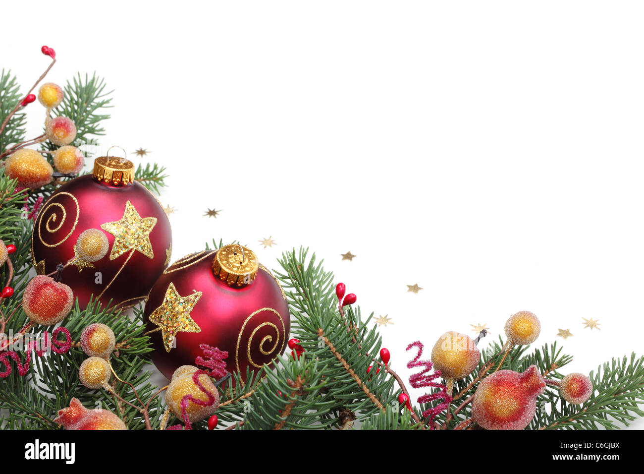 Pine branches,berries and balls for Christmas border. Stock Photo