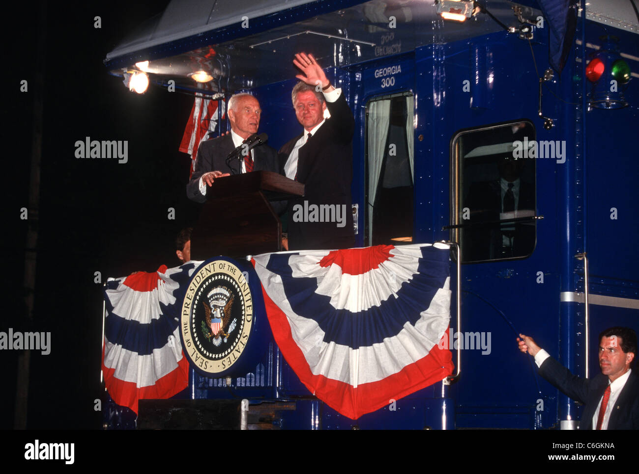 President Bill Clinton and Sen. John Glenn wave during a campaign stop ...