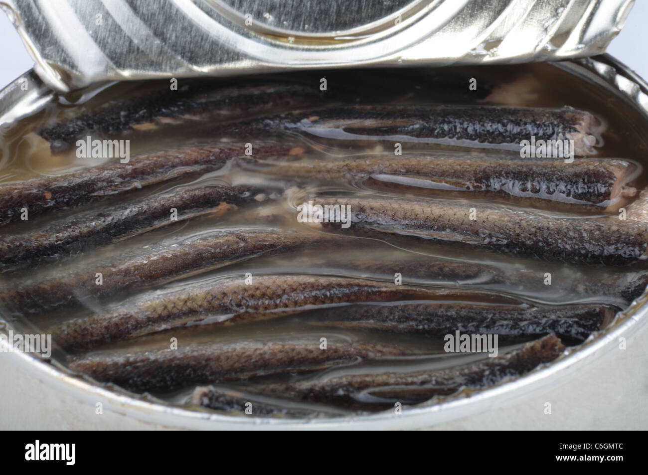 canned fish in open tin Stock Photo