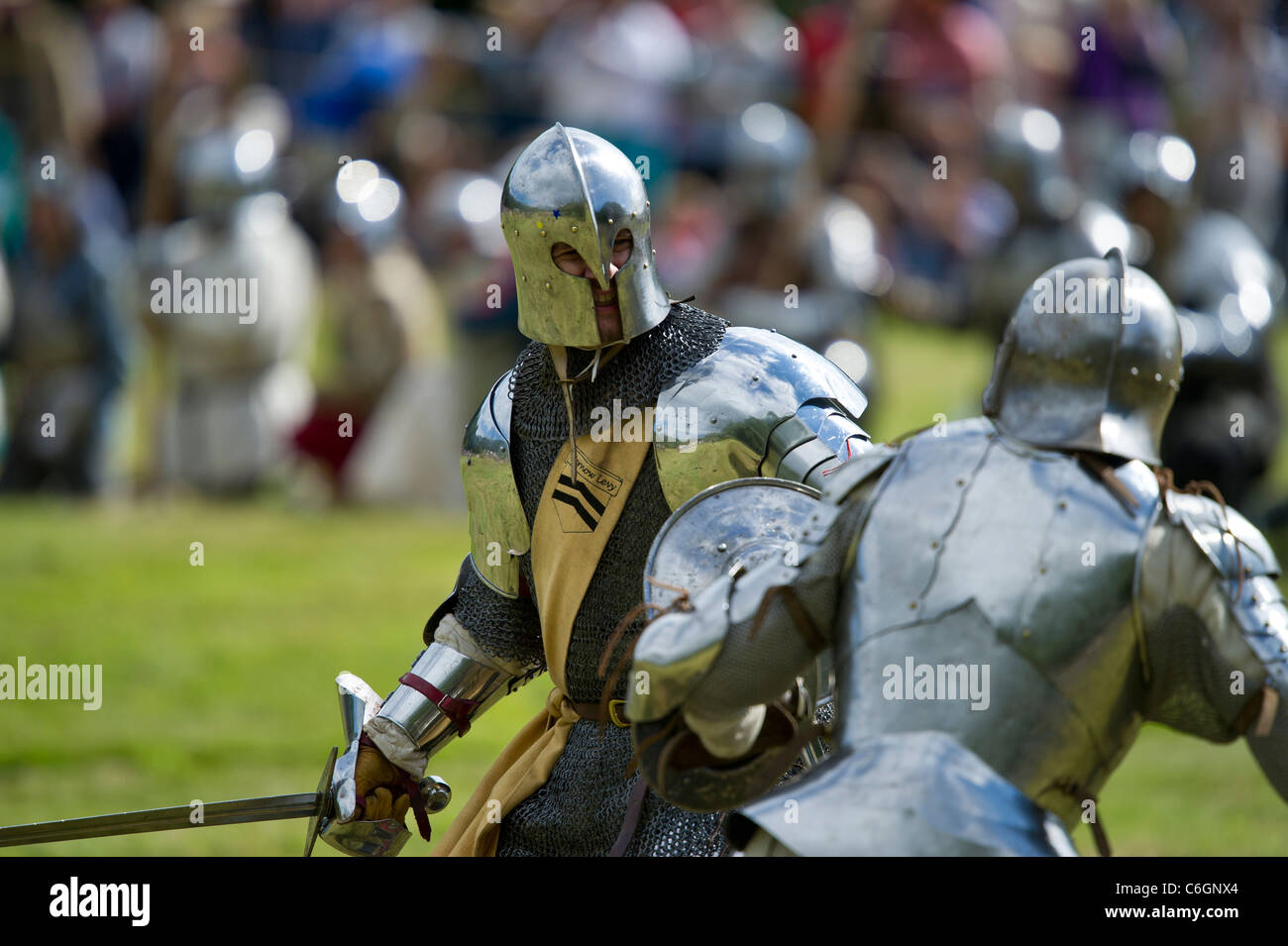 Medieval battle re-enactment at Herstmonceux Castle in Sussex UK Stock Photo