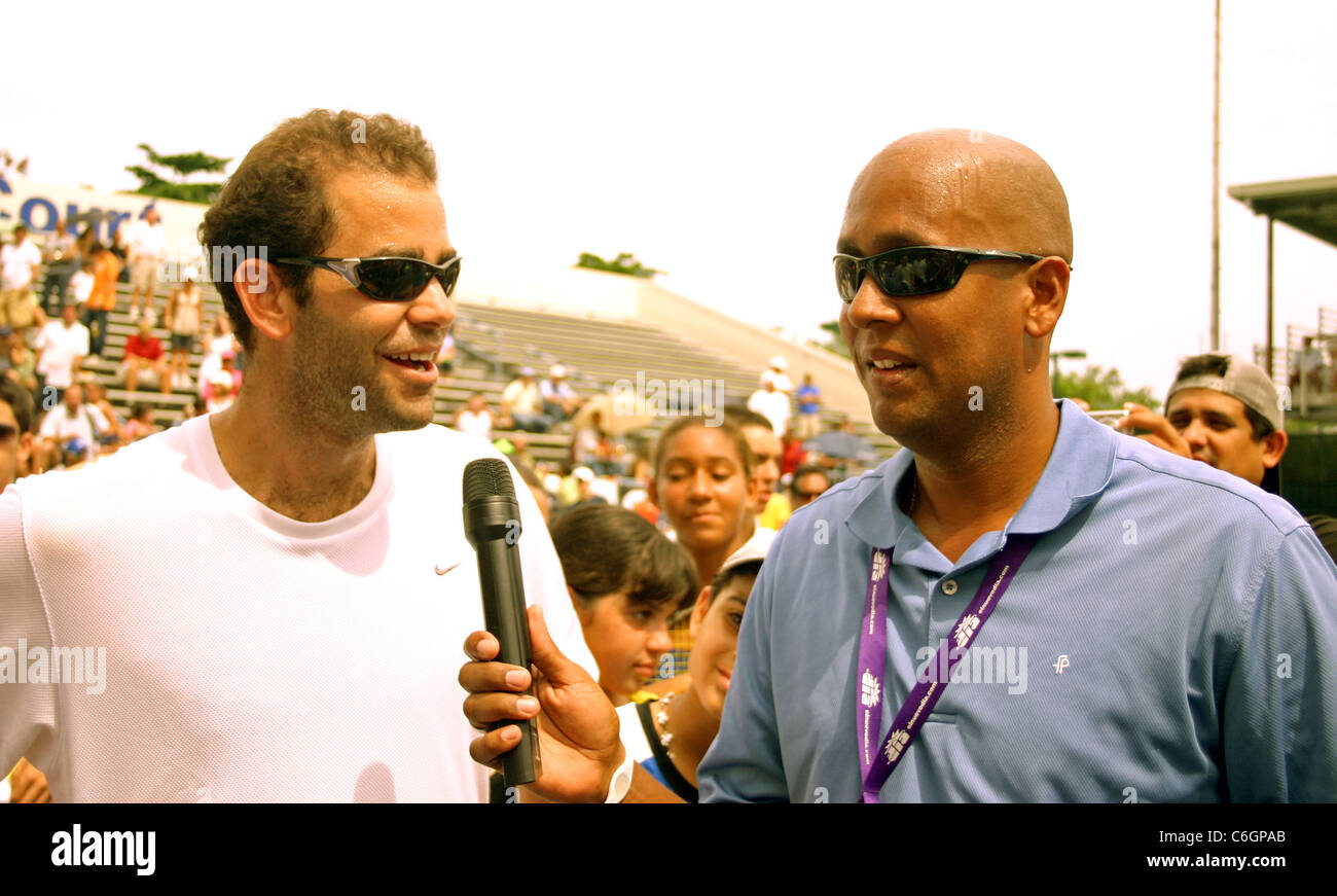 Retired US tennis champions Andre Agassi and Pete Sampras open a free Tennis Clinic to encourage young children to get into the Stock Photo