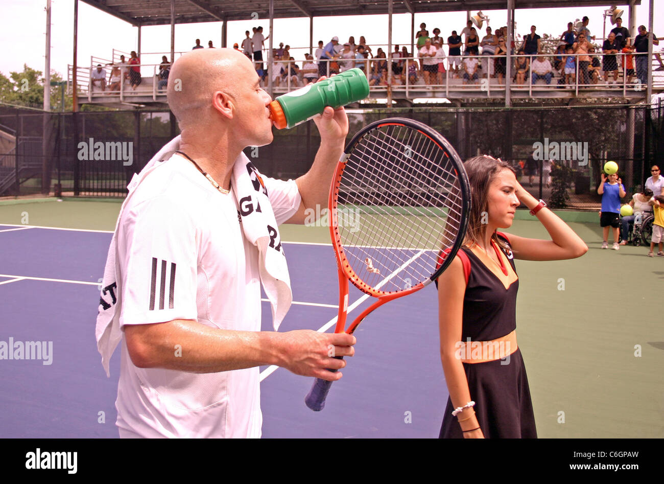 Retired US tennis champions Andre Agassi and Pete Sampras open a free Tennis Clinic to encourage young children to get into the Stock Photo