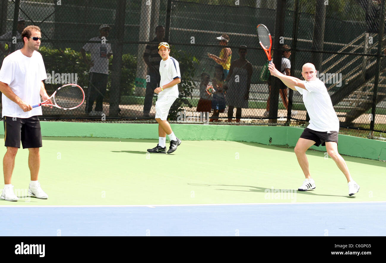 Retired US tennis champions Andre Agassi and Pete Sampras open a free Tennis Clinic to encourage young children to get into the Stock Photo