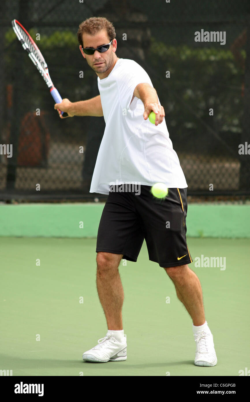 Retired US tennis champions Andre Agassi and Pete Sampras open a free Tennis Clinic to encourage young children to get into the Stock Photo