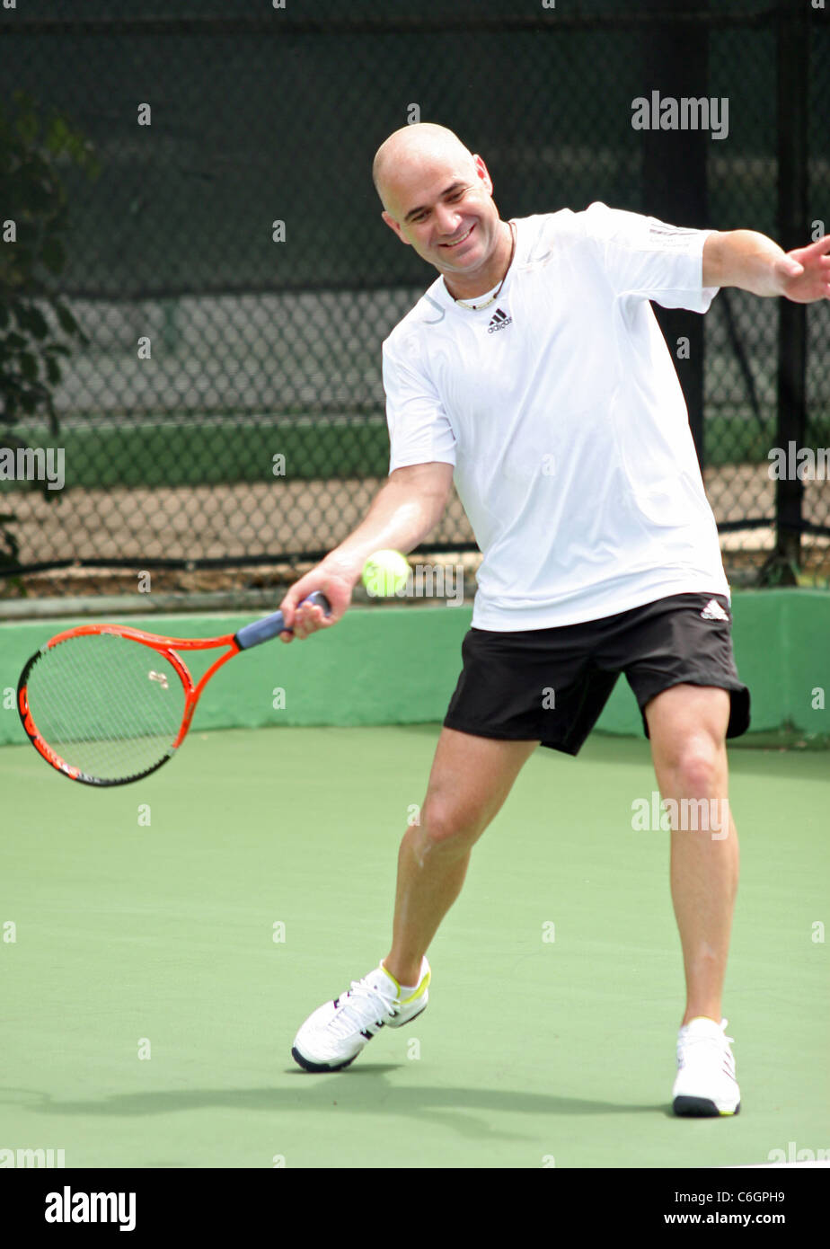 Retired US tennis champions Andre Agassi and Pete Sampras open a free Tennis  Clinic to encourage young children to get into the Stock Photo - Alamy