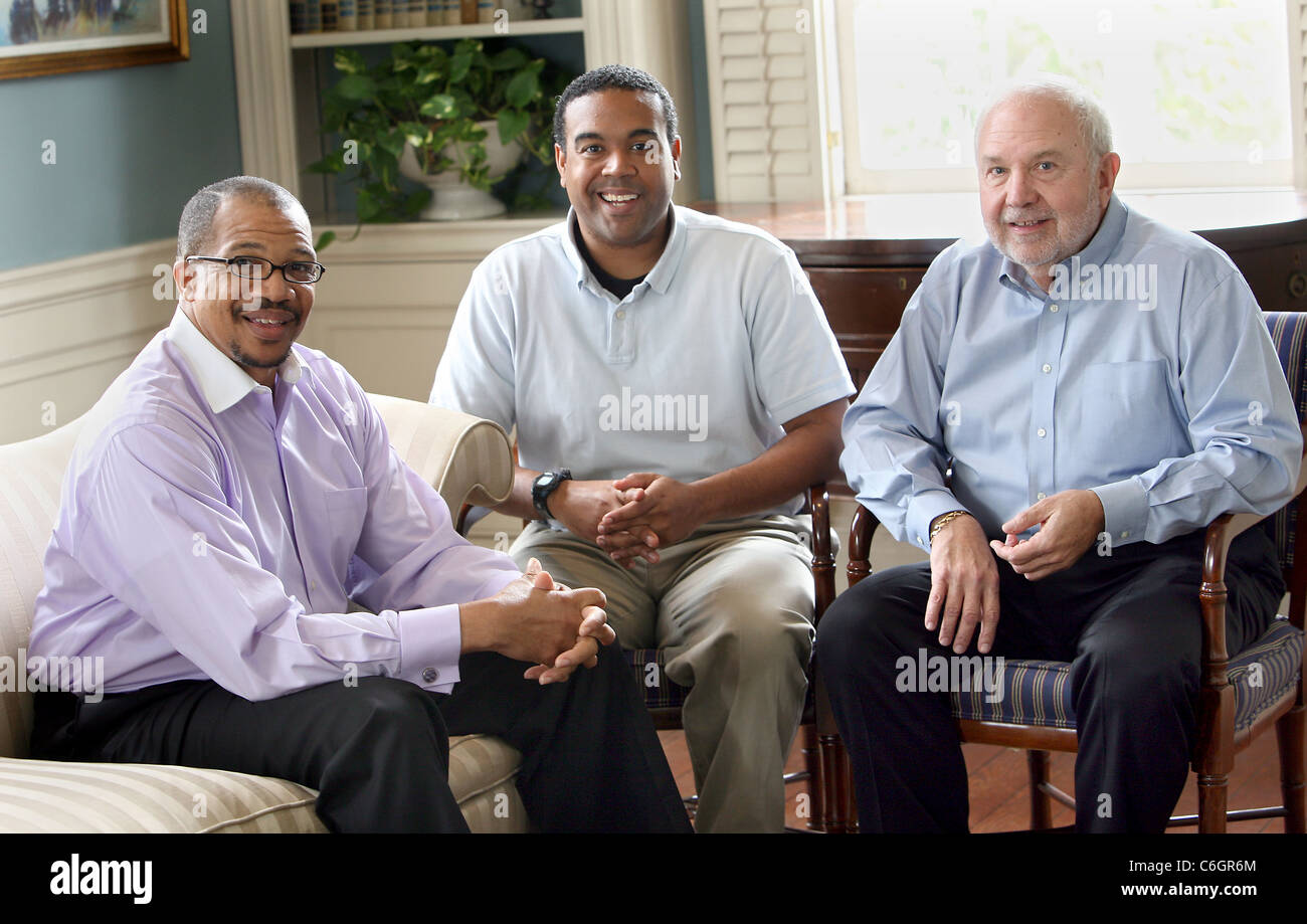 Three men pose for a lifestyle photo for health care related use. Stock Photo