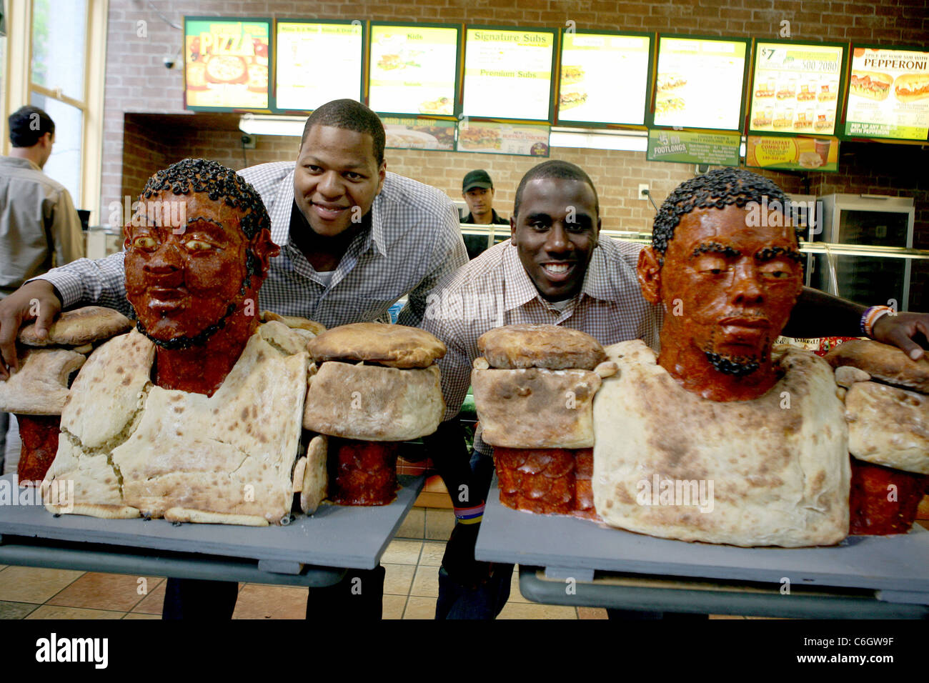 Top NFL draft prospects Ndamukong Suh and C. J. Spiller unveil their life-size busts made from pepperoni at Subway sandwich Stock Photo
