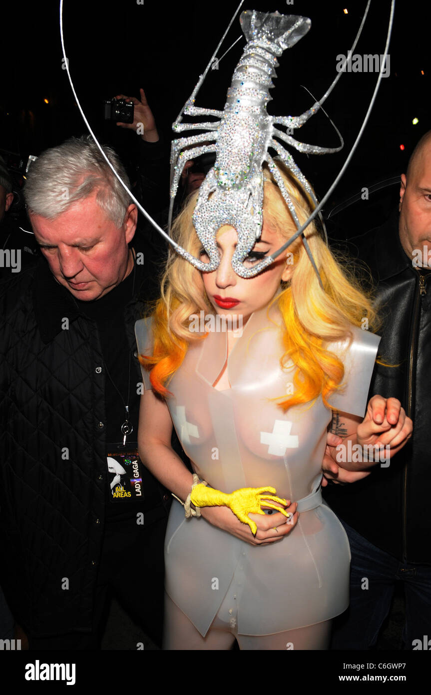 Lady Gaga arriving at Mr Chow restaurant in London, wearing a see-through  plastic dress and a silver lobster headpiece Stock Photo - Alamy