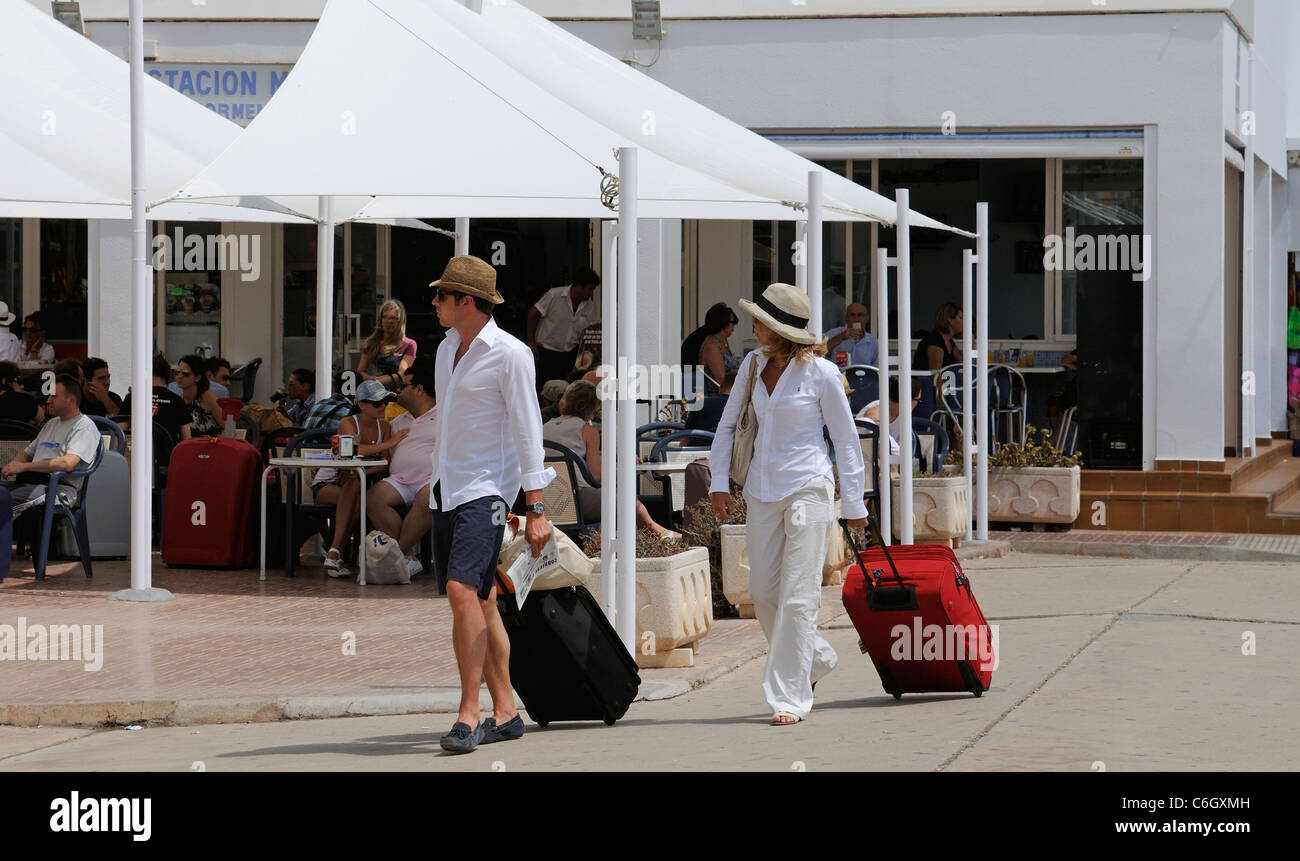Holidaymakers with luggage on the quayside at Eivissa on the Spanish Island of Ibiza Stock Photo