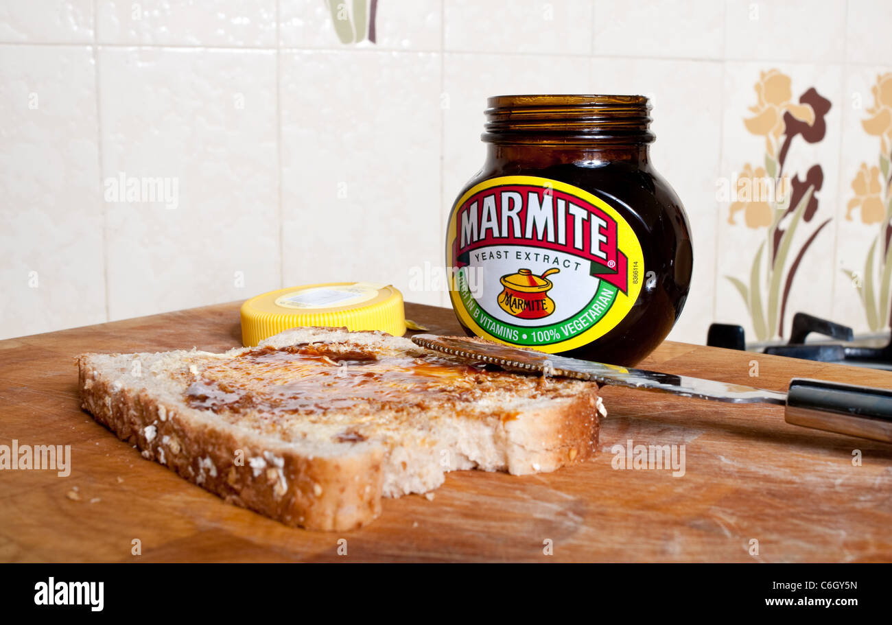 Love it or hate it bread and butter with jar of marmite UK Stock Photo