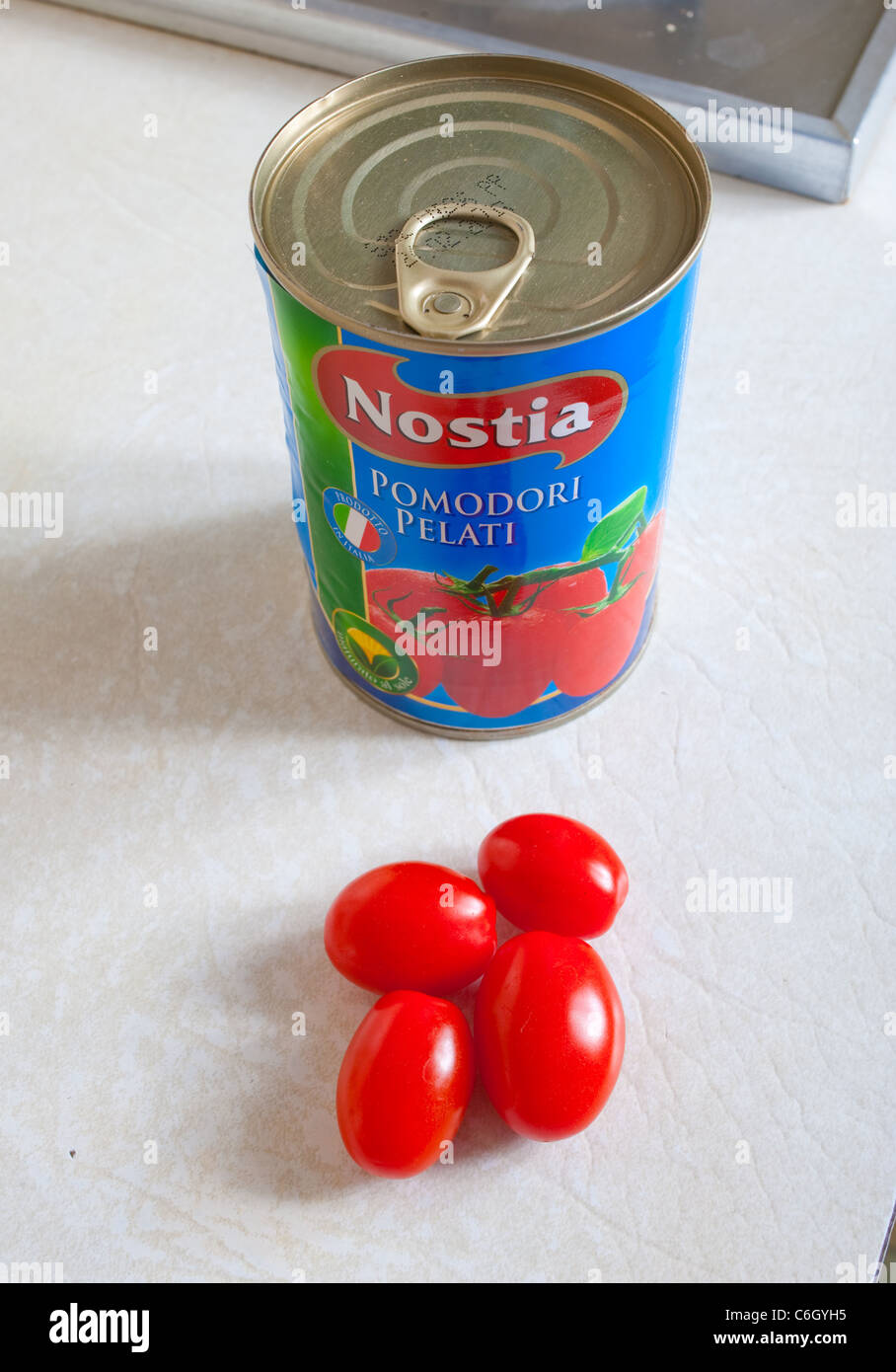 Can of Nostia plum tomatoes in kitchen uk Stock Photo