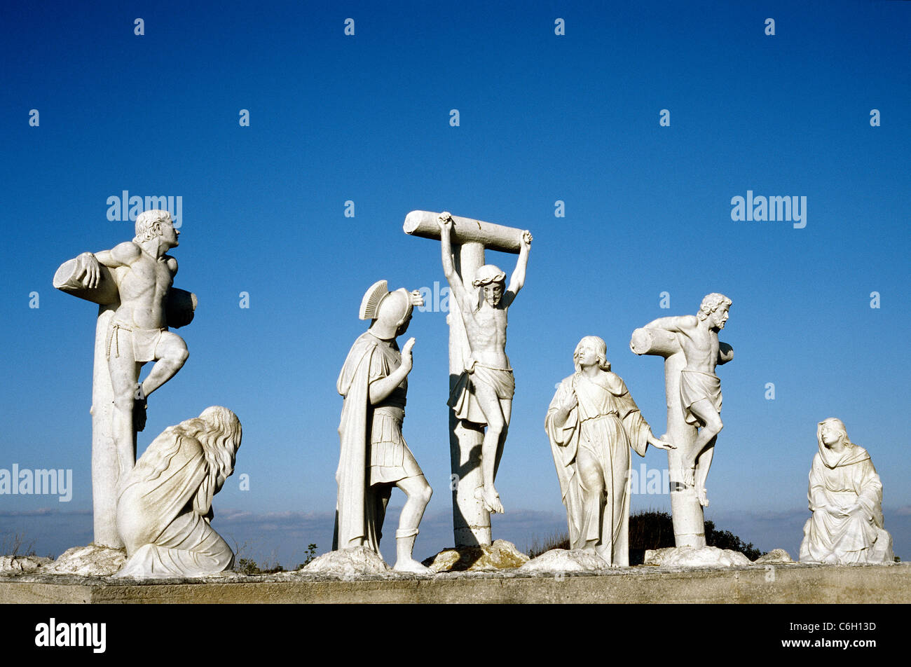 Jesus dies on the Cross. Marble sculptures depicting the final hours of Jesus at the Way of the Cross on Gozo island in Malta. Stock Photo
